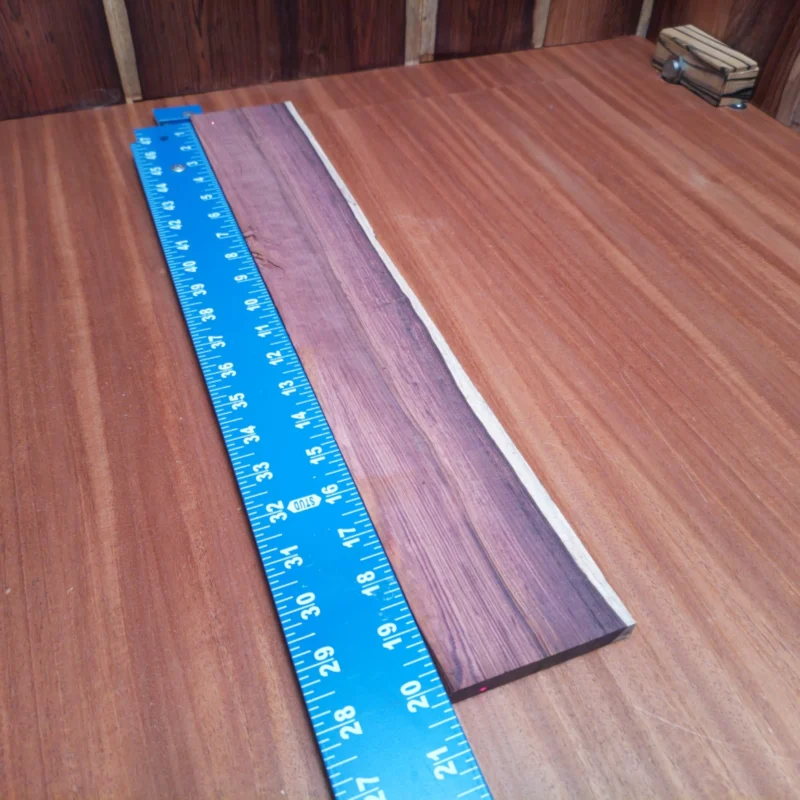 Ignite your luthier passion with our Honduran Rosewood blank! This stunning acoustic wood not only boasts a rich tonal quality but also features a unique rift sawn design that enhances your instrument's visual appeal. Perfect for creating high-end guitars, this blank allows for superior craftsmanship and durability. Experience the blend of beauty and performance today! It is a Honduran Rosewood Acoustic Rift Sawn fingerboard blank with dimensions of 20.1 x 3.2 x 0.4 inches.