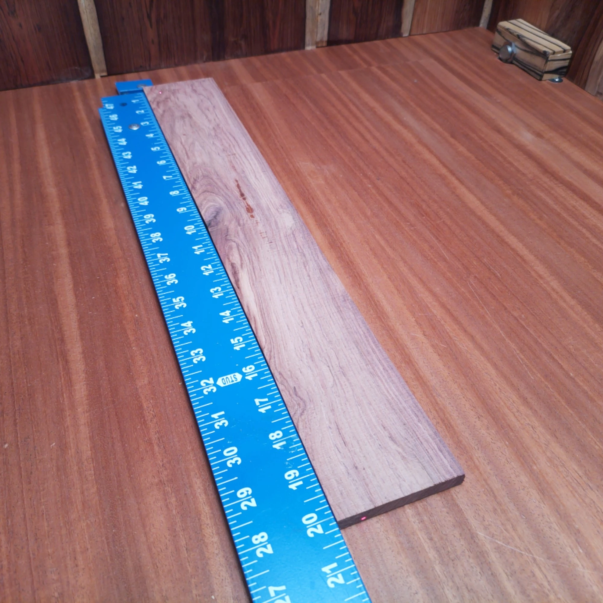 Honduran Rosewood Acoustic Rift Sawn Fingerboard Blank 0.4" X 2.9" X 20.1" - HRAFBR000369 1 This Honduran Rosewood acoustic blank is perfect for crafting beautiful fingerboards. Its rift-sawn grain enhances tonal quality and stability, providing a premium playing experience. With rich color and striking patterns, it adds distinctive flair to any instrument. Ideal for luthiers looking to create a masterpiece, this blank combines durability with elegance, making your next project a showstopper. It is a Honduran Rosewood Acoustic Rift Sawn fingerboard blank with dimensions of 20.1 x 2.9 x 0.4 inches.