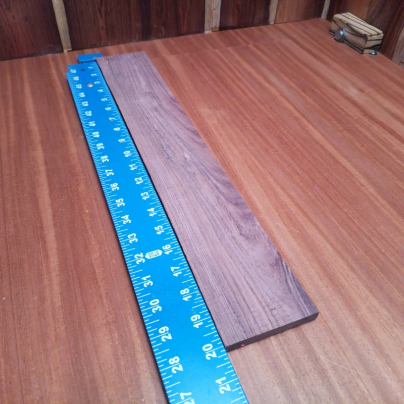 Fingerboard Blanks 48 Perfect for luthiers, this Honduran Rosewood blank boasts a stunning natural grain, ideal for acoustics! Measuring a convenient size, it allows for easy handling and versatile crafting. Elevate your guitar projects with this durable and resilient wood, known for its rich tone and beautiful finish. Whether you're an experienced builder or a passionate hobbyist, this fingerboard blank is a must-have in your workshop! It is a Honduran Rosewood Acoustic Rift Sawn fingerboard blank with dimensions of 20.1 x 3.1 x 0.3 inches.