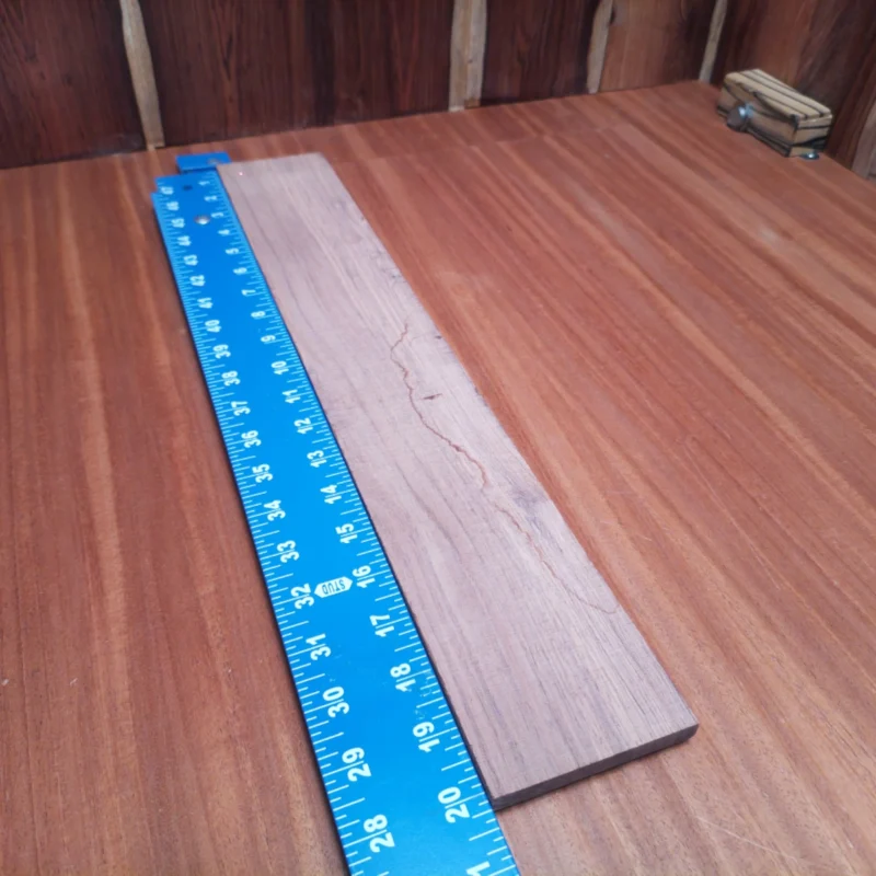 Fingerboard Blanks 37 Craft your next masterpiece with this Honduran Rosewood blank. With its dense grain and rich coloration, it’s perfect for creating resonant soundboards or intricate side pieces. Luthiers will appreciate its stability and workability, making it ideal for any acoustic instrument. Unleash your creative potential with this premium choice that combines beauty and functionality in every strum! It is a Honduran Rosewood Acoustic Rift Sawn fingerboard blank with dimensions of 20.2 x 2.8 x 0.3 inches.