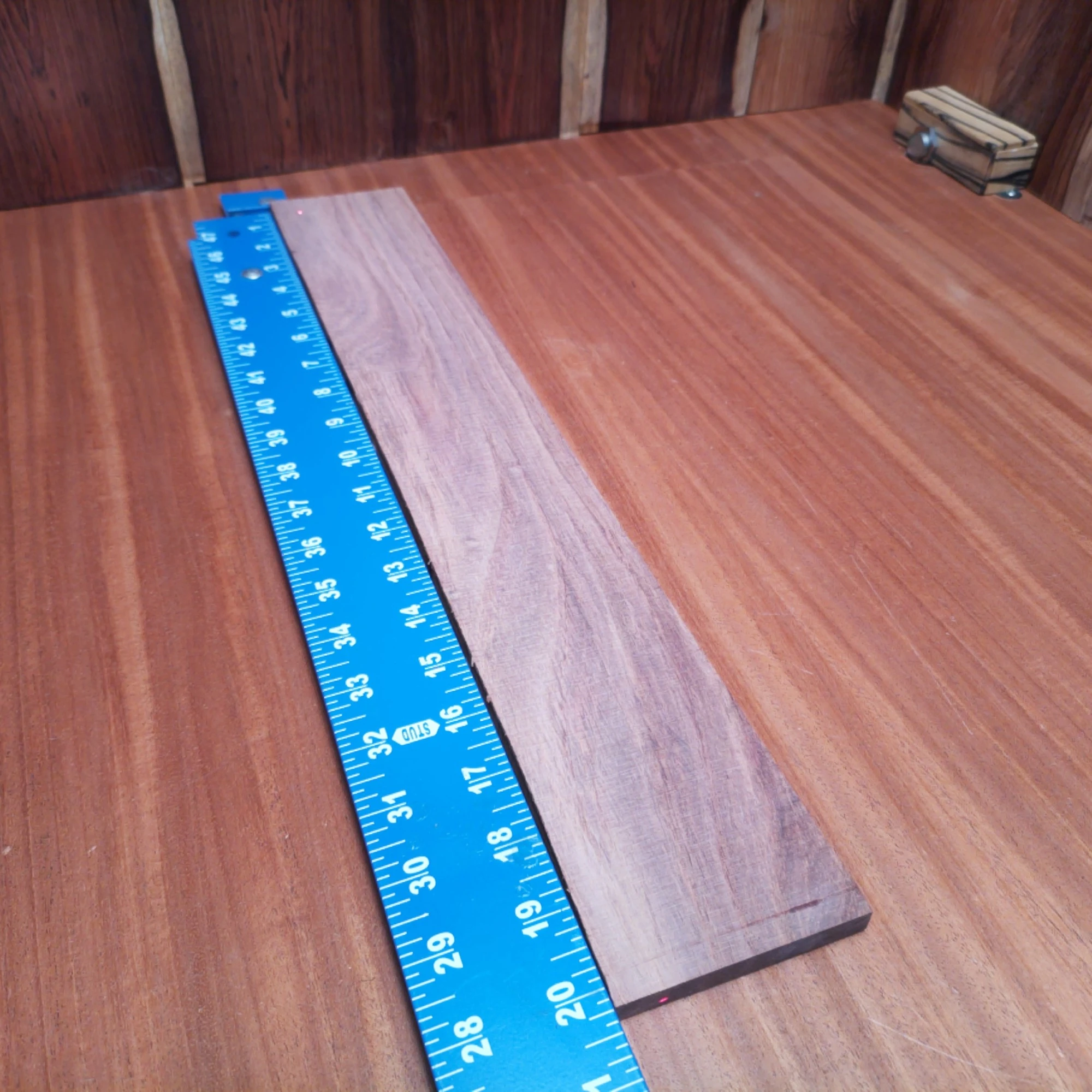 Honduran Rosewood Acoustic Rift Sawn Fingerboard Blank 0.4" X 3.2" X 20.2" - HRAFBR000395 1 Crafted from exquisite Honduran Rosewood, this fingerboard blank is perfect for luthiers seeking quality and durability. With its rift sawn design, it ensures improved stability and vibrant tonal qualities. Ideal for acoustic instruments, it boasts beautiful grain patterns and rich hues that enhance any project. Elevate your craftsmanship with this essential fingerboard blank, designed to create stunning sound and look fantastic in any build. It is a Honduran Rosewood Acoustic Rift Sawn fingerboard blank with dimensions of 20.2 x 3.2 x 0.4 inches.