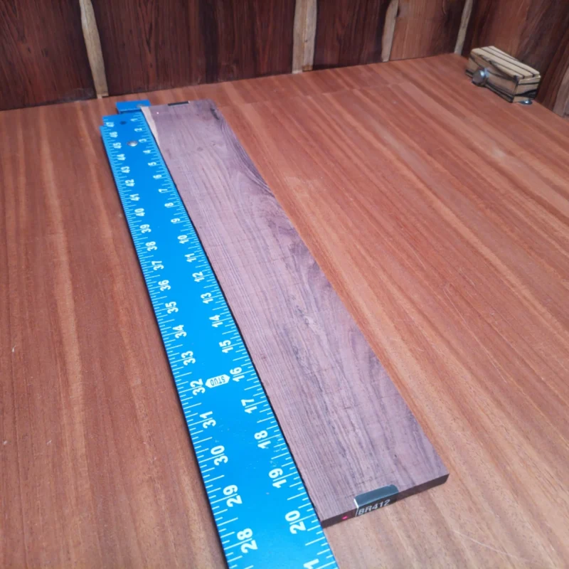 Craft your next acoustic masterpiece with this Honduran Rosewood blank. Known for its rich tonal qualities and stunning appearance, this rift sawn wood is perfect for luthiers seeking durability and elegance in their instruments. Its unique grain patterns not only enhance the aesthetics but also contribute to superior sound projection. This blank measures 0.4" x 3.3" x 20.2", making it an ideal size for your projects. It is a Honduran Rosewood Acoustic Rift Sawn fingerboard blank with dimensions of 20.2 x 3.3 x 0.4 inches.