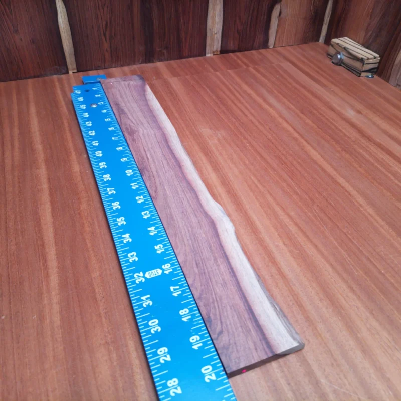 Fingerboard Blanks 104 Elevate your guitar creations with this premium Honduran rosewood blank. This acoustic rift sawn piece is perfect for luthiers looking to craft beautiful, resonant instruments. Known for its rich tonal quality and stunning grain patterns, this wood promises a luxurious playing experience. Ideal for back and sides or intricate custom work, you'll find this blank a must-have in your workshop. It is a Honduran Rosewood Acoustic Rift Sawn fingerboard blank with dimensions of 20.1 x 2.7 x 0.4 inches.