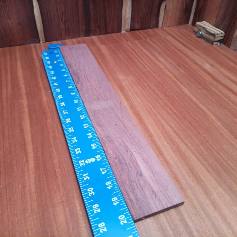 Fingerboard Blanks 40 Elevate your instrument-building game with this premium Honduran Rosewood blank. Ideal for luthiers, this rift sawn piece offers a stunning grain pattern and rich tonal qualities that enhance acoustic dynamics. Crafted for better playability, it’s the perfect choice for your guitar projects. Don’t just build an instrument, create art that resonates! It is a Honduran Rosewood Acoustic Rift Sawn fingerboard blank with dimensions of 20.2 x 2.9 x 0.3 inches.
