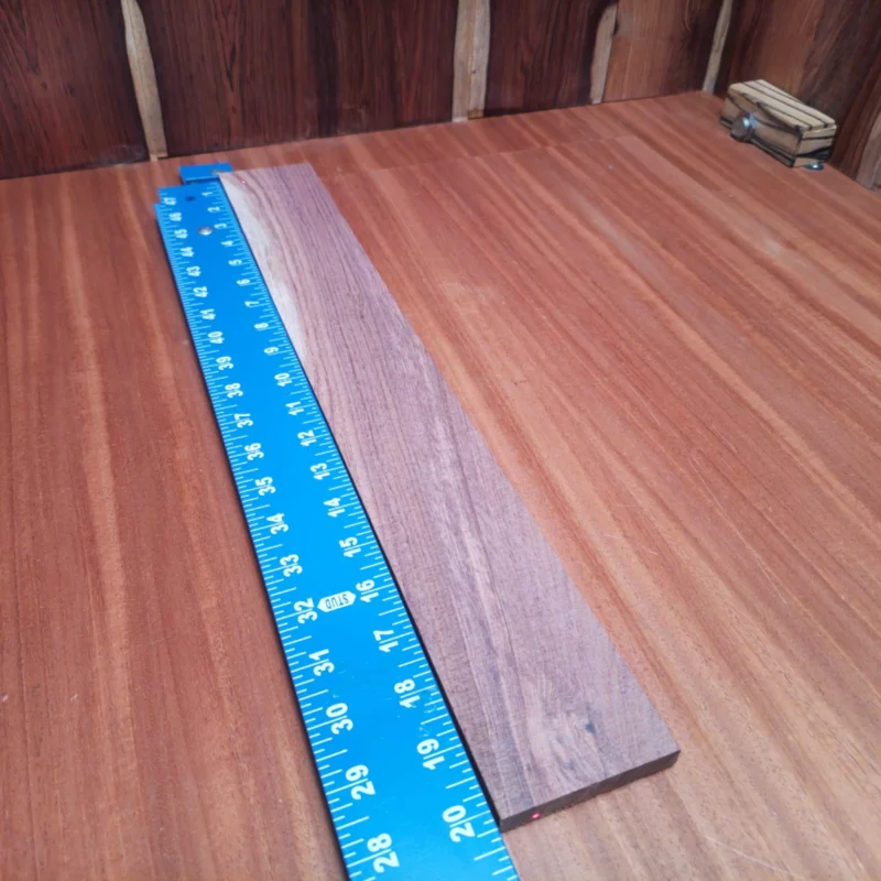 Fingerboard Blanks 108 Elevate your luthier skills with this Honduran rosewood blank. Known for its warm tone and beautiful grain patterns, this acoustic blank promises to enhance any instrument's sound quality. Perfect for luthiers seeking durability and aesthetics, it offers solid performance for your next project. Embrace the richness that this blank brings and create a handcrafted masterpiece that resonates with deep, melodic tones. It's time to let your creativity shine! It is a Honduran Rosewood Acoustic Rift Sawn fingerboard blank with dimensions of 20.1 x 2.7 x 0.4 inches.