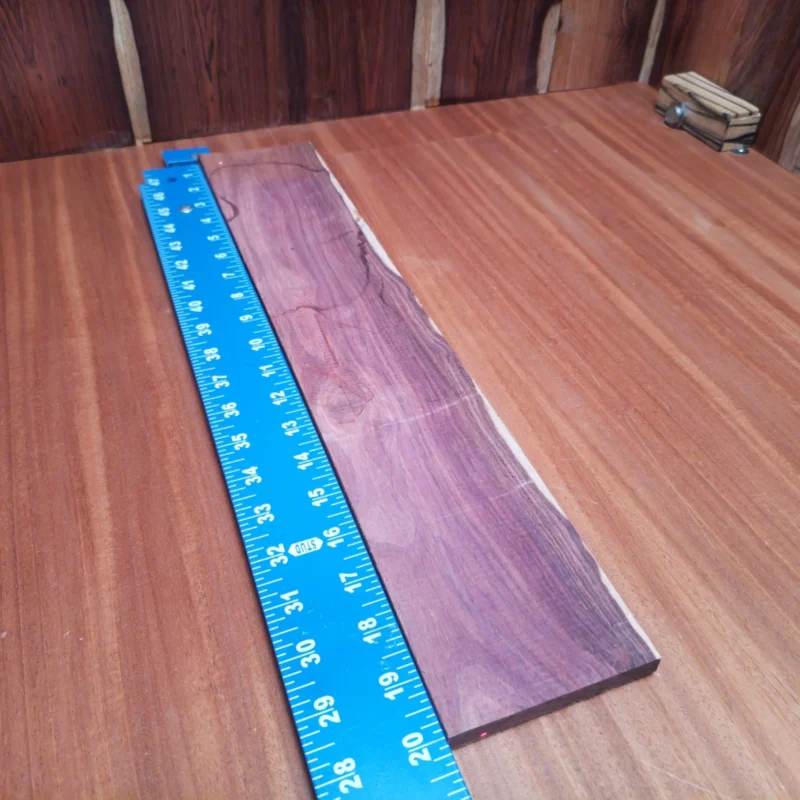 Honduran Rosewood Acoustic Rift Sawn Fingerboard Blank 0.4" X 3.7" X 20.1" - HRAFBR000451 3 Elevate your acoustic creations with this rift sawn Honduran Rosewood blank! Perfectly dimensions for your custom fingerboards, it combines stunning visuals with outstanding tonal qualities. Luthiers love its rich character and durability, making it a favorite for serious artisans. This wood not only enhances sound projection but also adds a touch of elegance to each build. Unleash your creativity and craft fingerboards that resonate with the true spirit of music! It is a Honduran Rosewood Acoustic Rift Sawn fingerboard blank with dimensions of 20.1 x 3.7 x 0.4 inches.