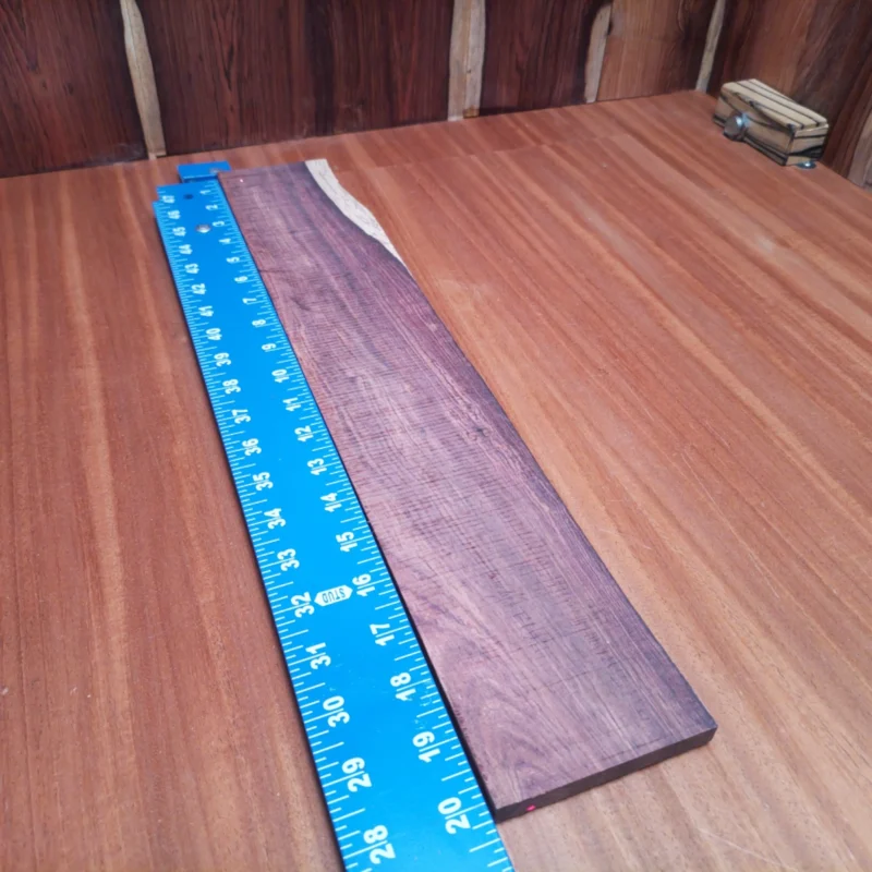Unlock your creativity with this Honduran Rosewood blank. Perfectly rift sawn and rich in color, it provides luthiers with a stunning foundation to craft acoustic instruments that sing. Its robust density delivers exceptional tonal quality, while the beautiful grain pattern makes each piece unique. Whether you’re a seasoned pro or just starting out, this fingerboard blank is your ticket to building a one-of-a-kind masterpiece. Elevate your craft with this premium wood! It is a Honduran Rosewood Acoustic Rift Sawn fingerboard blank with dimensions of 20.1 x 3.6 x 0.4 inches.