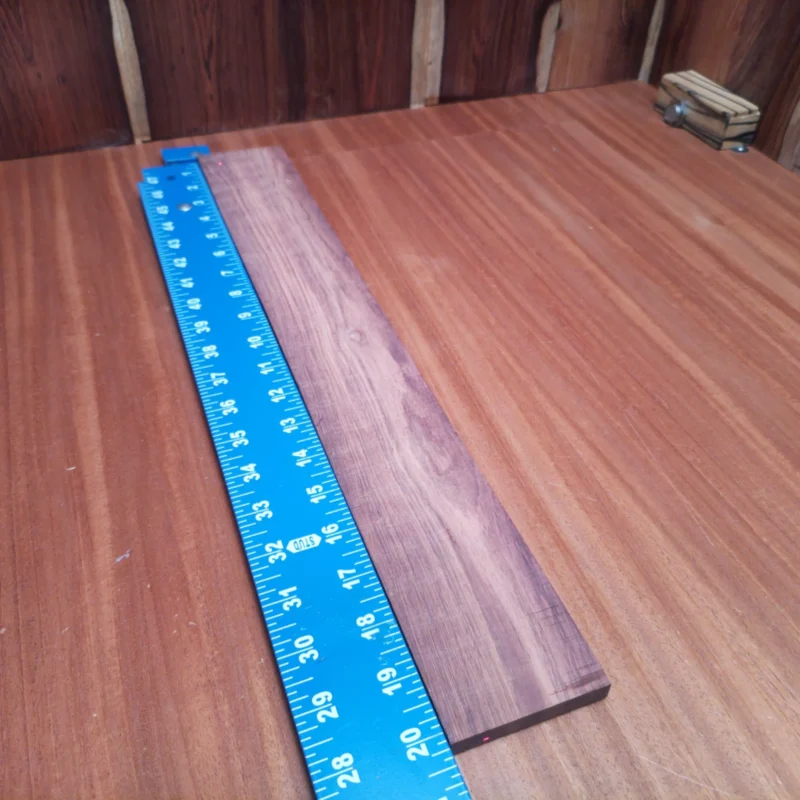 Fingerboard Blanks 120 Crafted from premium Honduran Rosewood, this fingerboard blank boasts a striking rift sawn finish. Perfect for luthiers seeking quality, its rich tonal properties ensure an incredible sound experience. With its ideal dimensions, it offers versatility for various acoustic projects, allowing you to shape and mold to your desired specifications. Elevate your instrument-making with this beautiful, durable, and visually stunning fingerboard piece that resonates elegance and performance. It is a Honduran Rosewood Acoustic Rift Sawn fingerboard blank with dimensions of 20.2 x 2.7 x 0.4 inches.