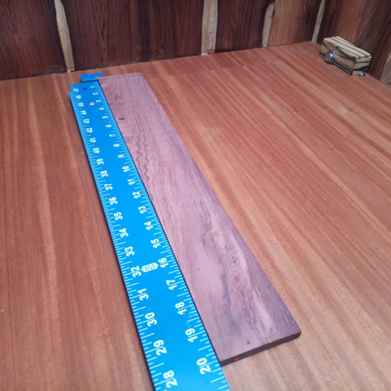 Crafted from top-quality Honduran Rosewood, this acoustic fingerboard blank delivers outstanding sound resonance and durability. Impress your clients with a stunning wood grain, perfect for rich tonal quality. Ideal for luthiers looking to elevate their instrument-making game, this versatile fingerboard blank combines beauty and functionality for powerful performances. Get ready to create jaw-dropping guitars that will steal the show! It is a Honduran Rosewood Acoustic Rift Sawn fingerboard blank with dimensions of 20.1 x 2.9 x 0.4 inches.