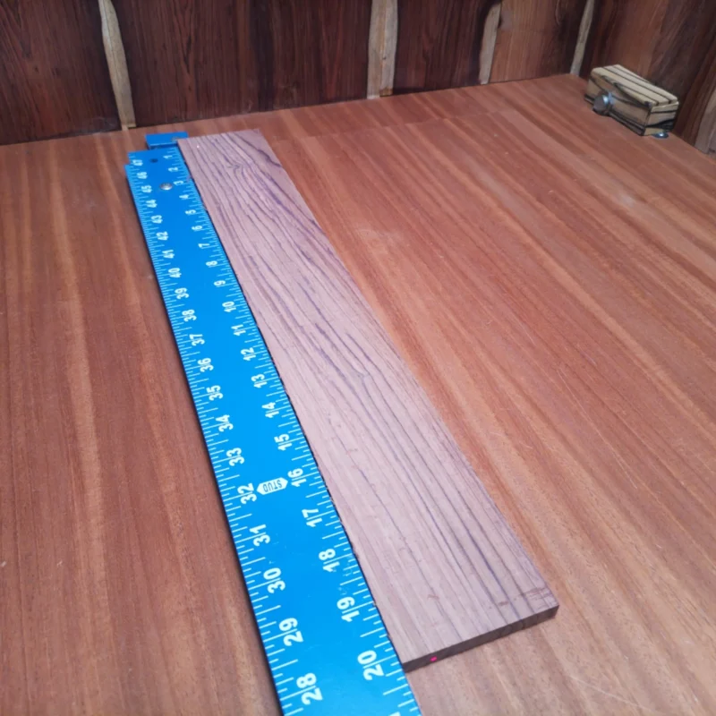 Elevate your next luthier project with this premium Honduran Rosewood blank. Its rich tonal qualities and stunning rift-sawn grain make it ideal for crafting vibrant acoustic instruments. Perfect for guitars, ukuleles, or any string instrument, this blank ensures durability and a beautiful finish, drawing musicians to its playability. Work with a piece that combines both aesthetic appeal and exceptional sound quality, and let your creativity blossom! It is a Honduran Rosewood Acoustic Rift Sawn fingerboard blank with dimensions of 20.2 x 3.0 x 0.4 inches.