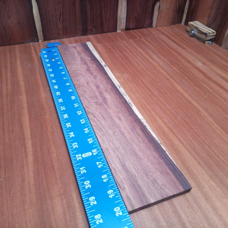 Fingerboard Blanks 67 Elevate your luthiery game with our Honduran Rosewood blank! This premium acoustic material boasts rich tones, making it perfect for crafting stunning instruments. With its beautiful grain and versatility, it’s an ideal choice for experienced luthiers looking to create masterpiece guitars or any stringed project. Enjoy the balance of aesthetics and sound quality in every strum! It is a Honduran Rosewood Acoustic Rift Sawn fingerboard blank with dimensions of 20.2 x 3.8 x 0.3 inches.