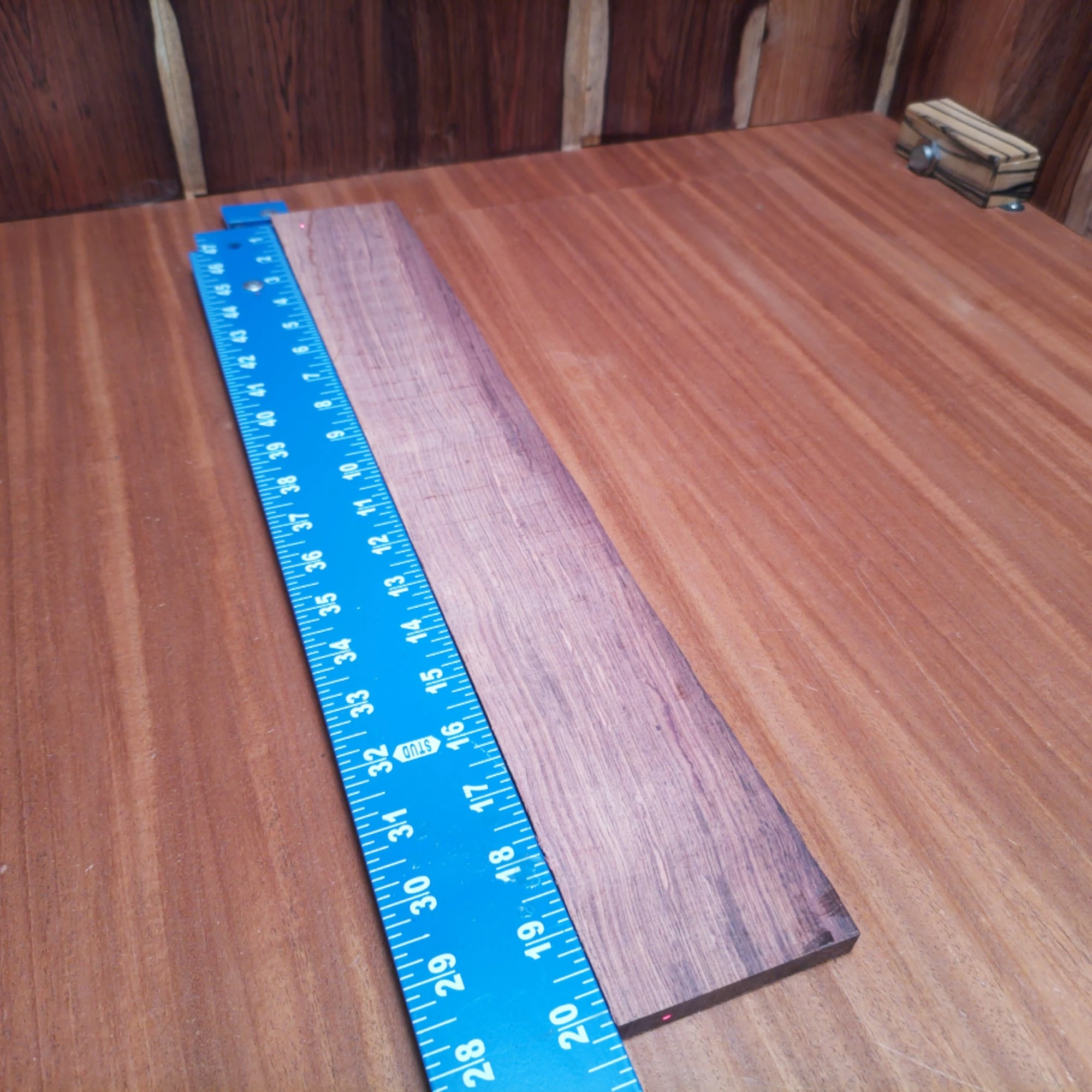 Honduran Rosewood Acoustic Rift Sawn Fingerboard Blank 0.4" X 2.9" X 20.1" - HRAFBR000580 1 Unlock your creative potential with our premium Honduran Rosewood fingerboard blank. Perfectly crafted for luthiers, this beautifully rift-sawn wood boasts a rich tonal quality and stunning grain. It's an ideal choice for creating smooth-playing, resonant instruments that shine on stage. Elevate your craftsmanship and impress your audience with the perfect blend of sound and style. Prepare to take your builds to the next level! It is a Honduran Rosewood Acoustic Rift Sawn fingerboard blank with dimensions of 20.1 x 2.9 x 0.4 inches.