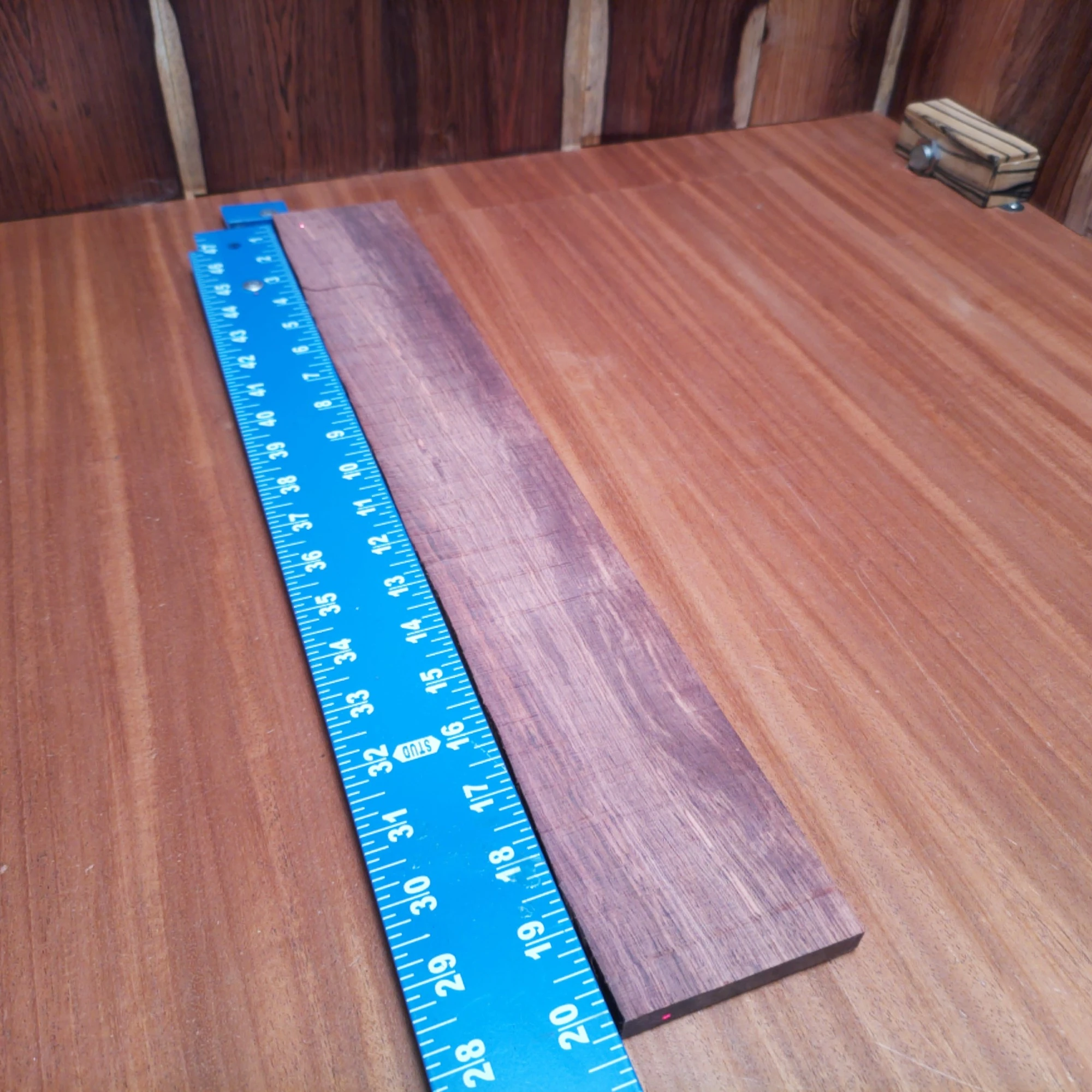 Honduran Rosewood Acoustic Rift Sawn Fingerboard Blank 0.4" X 2.9" X 20.1" - HRAFBR000580 2 Unlock your creative potential with our premium Honduran Rosewood fingerboard blank. Perfectly crafted for luthiers, this beautifully rift-sawn wood boasts a rich tonal quality and stunning grain. It's an ideal choice for creating smooth-playing, resonant instruments that shine on stage. Elevate your craftsmanship and impress your audience with the perfect blend of sound and style. Prepare to take your builds to the next level! It is a Honduran Rosewood Acoustic Rift Sawn fingerboard blank with dimensions of 20.1 x 2.9 x 0.4 inches.