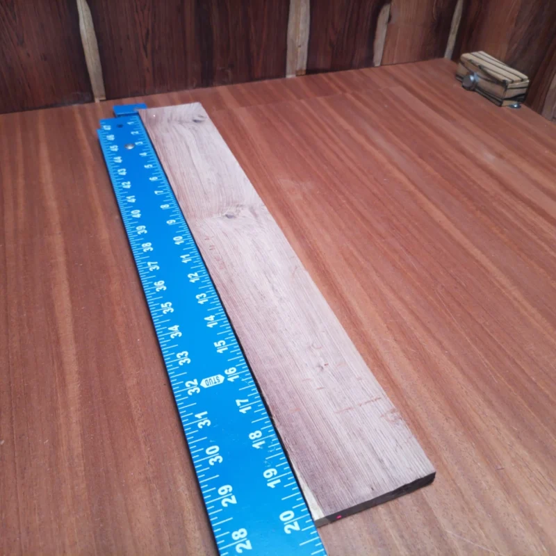 Unlock the potential of your next acoustic instrument with this premium Honduran Rosewood blank. Its rich, warm tones and stunning rift-sawn grain make it perfect for luthiers seeking to create beautiful, resonant soundboards. Ideal for guitars and other stringed instruments, this high-quality wood enhances both aesthetics and acoustics, ensuring your creations stand out in any performance. It is a Honduran Rosewood Acoustic Rift Sawn fingerboard blank with dimensions of 20.1 x 2.9 x 0.4 inches.