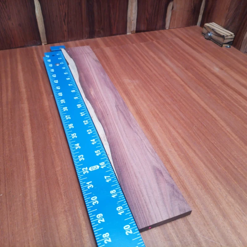 Crafted from premium Honduran Rosewood, this fingerboard blank offers exceptional tonal qualities and striking aesthetics. Perfectly rift-sawn for optimal strength and stability, it enables luthiers to create beautiful instruments that resonate with warmth and clarity. Whether you're a seasoned luthier or a DIY enthusiast, this fingerboard blank is your step towards crafting the perfect guitar. Enhance your projects with this durable and visually stunning wood! It is a Honduran Rosewood Acoustic Rift Sawn fingerboard blank with dimensions of 20.2 x 2.9 x 0.4 inches.