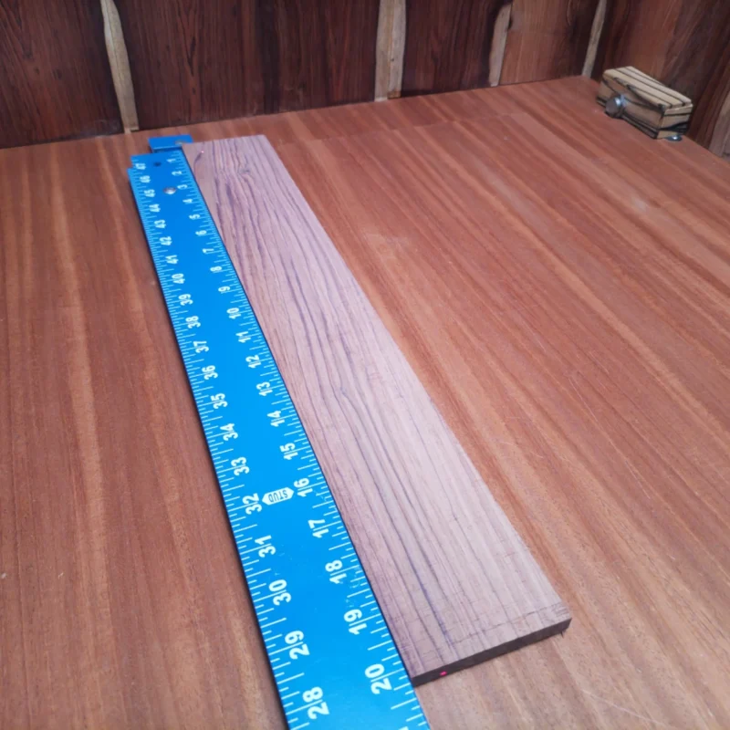 Discover the quality of this Honduran Rosewood fingerboards blank! Perfectly rift sawn, it's designed to deliver superb tonal clarity and stunning aesthetics. Luthiers will appreciate its durability and fine grain pattern, making each instrument unique. Elevate your guitar building game and impress your players with a blank that speaks to both sound quality and style. It is a Honduran Rosewood Acoustic Rift Sawn fingerboard blank with dimensions of 20.2 x 3.0 x 0.4 inches.