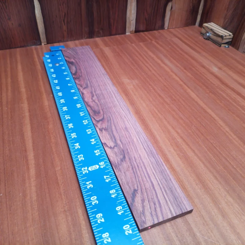Craft your dream instrument with this high-quality Honduran Rosewood blank. Its rift-sawn dimensions and rich tonal properties make it an ideal choice for crafting acoustics that resonate beautifully. Perfect for luthiers looking to enhance their musical creations, this versatile wood provides a blend of strength and aesthetic appeal. Elevate your instruments with this stunning fingerboards blank. It is a Honduran Rosewood Acoustic Rift Sawn fingerboard blank with dimensions of 20.1 x 3.0 x 0.4 inches.