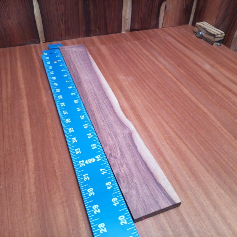 Fingerboard Blanks 124 Unlock your creativity with this Honduran Rosewood acoustic blank, perfect for luthiers and woodworkers alike. With its rich tone and stunning grain, it enhances sound quality while ensuring durability. Ideal for your next fingerboard project, the smooth texture allows for precision crafting. You'll find that this material not only looks fantastic but also delivers excellent resonance, making every strum sing with character. Give your instruments a touch of nature’s elegance! It is a Honduran Rosewood Acoustic Rift Sawn fingerboard blank with dimensions of 20.2 x 2.7 x 0.4 inches.