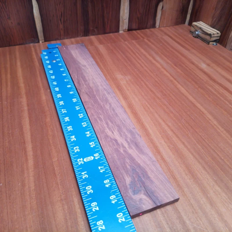 Honduran Rosewood Acoustic Rift Sawn Fingerboard Blank 0.4" X 2.9" X 20.1" - HRAFBR000593 3 Crafted from premium Honduran rosewood, this fingerboard blank is perfect for luthiers looking to create stunning acoustic instruments. Its rift sawn profile provides stability, while the rich, warm tones enhance the sound quality. Bring your guitar project to life with this top-quality blank that’s both visually appealing and play-ready. Upgrade your instrument creation with a timeless wood that combines beauty and functionality! It is a Honduran Rosewood Acoustic Rift Sawn fingerboard blank with dimensions of 20.1 x 2.9 x 0.4 inches.