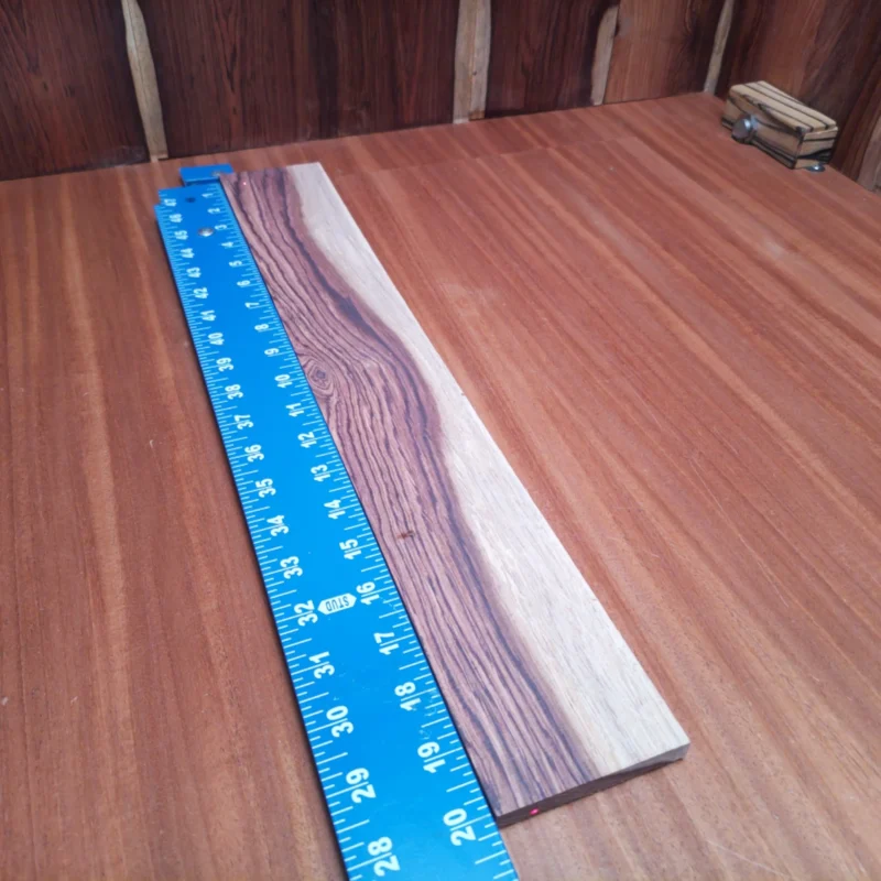 Unlock the potential of your next acoustic guitar with this stunning Honduran Rosewood blank. With rich tonal qualities and a beautiful grain pattern, this wood is a luthier’s dream. Ideal for crafting guitars that resonate with warmth and depth, it promises to elevate your instruments to new heights. Whether you're a seasoned pro or just starting, this blank will be your best companion. Get ready to strum your way to musical greatness! It is a Honduran Rosewood Acoustic Rift Sawn fingerboard blank with dimensions of 20.1 x 3.0 x 0.4 inches.