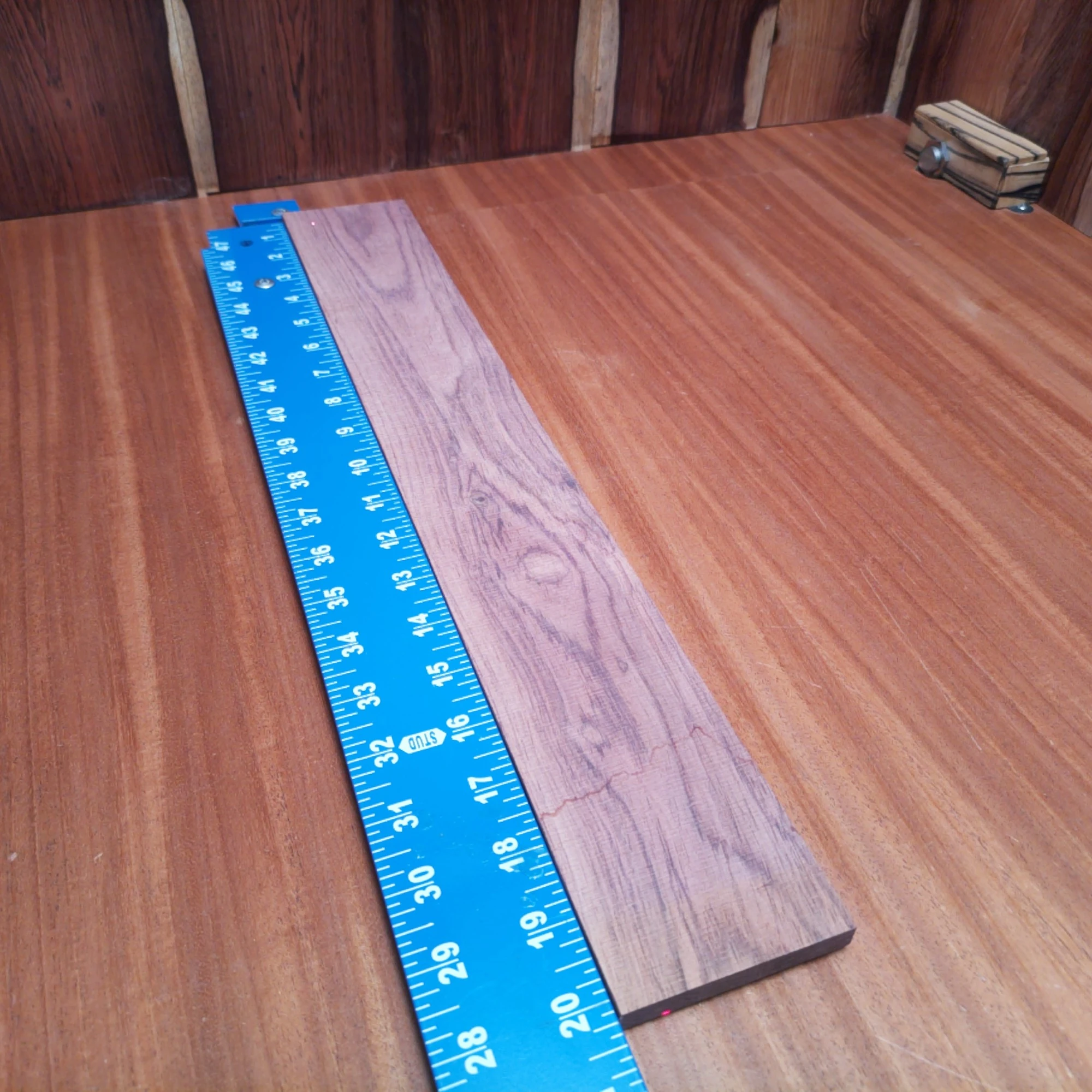 Honduran Rosewood Acoustic Rift Sawn Fingerboard Blank 0.4" X 2.9" X 20.2" - HRAFBR000597 1 Unlock your creativity with this premium Honduran Rosewood fingerboard blank! Perfect for luthiers, this stunning wood offers rich tonal qualities and durability. Its rift-sawn grain enhances stability and aesthetics, making it an ideal choice for your next project. Upgrade your instrument with this unique material for exquisite sound and flawless performance. Get ready to elevate your craftsmanship with this must-have fingerboard blank! It is a Honduran Rosewood Acoustic Rift Sawn fingerboard blank with dimensions of 20.2 x 2.9 x 0.4 inches.