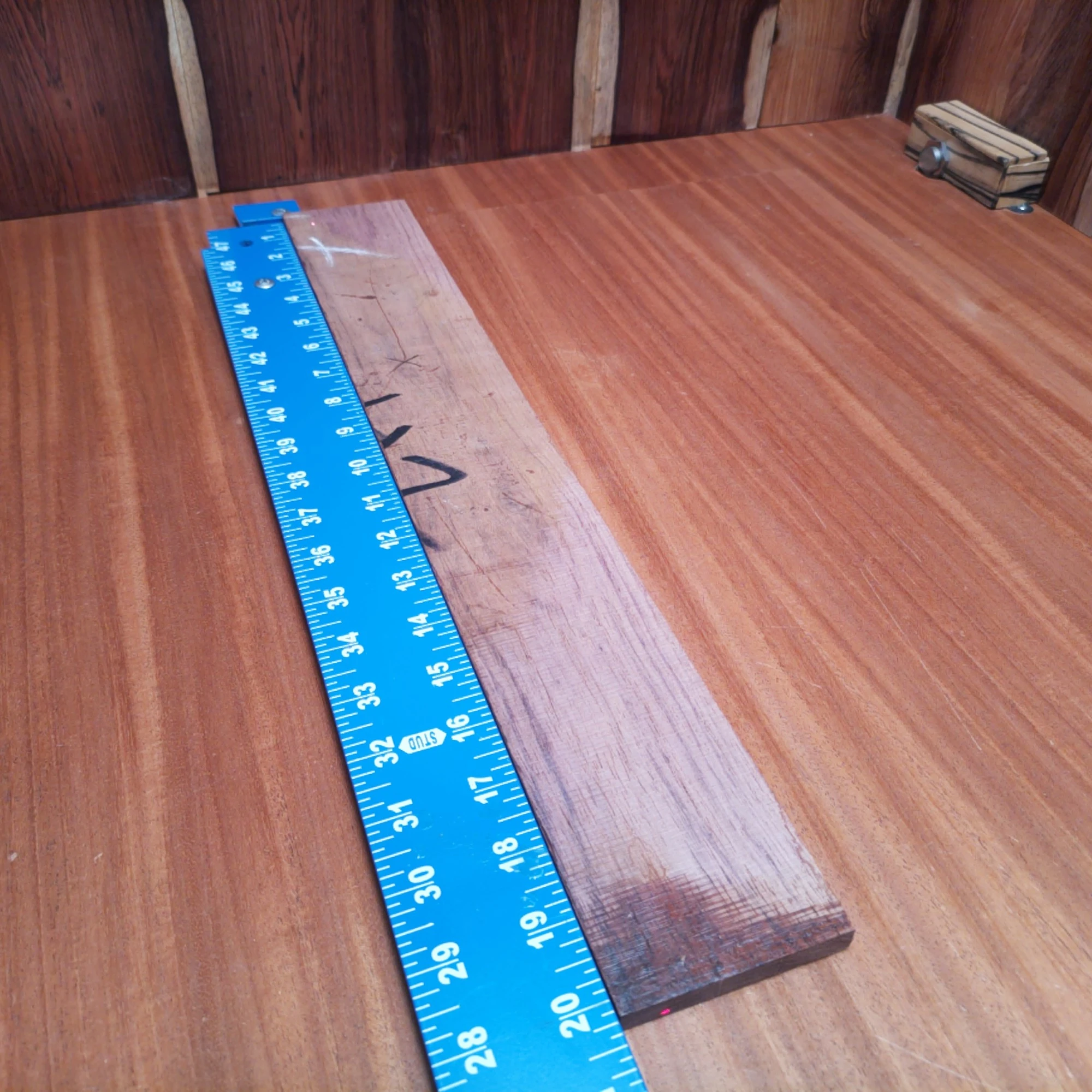 Honduran Rosewood Acoustic Rift Sawn Fingerboard Blank 0.4" X 2.9" X 20.2" - HRAFBR000597 2 Unlock your creativity with this premium Honduran Rosewood fingerboard blank! Perfect for luthiers, this stunning wood offers rich tonal qualities and durability. Its rift-sawn grain enhances stability and aesthetics, making it an ideal choice for your next project. Upgrade your instrument with this unique material for exquisite sound and flawless performance. Get ready to elevate your craftsmanship with this must-have fingerboard blank! It is a Honduran Rosewood Acoustic Rift Sawn fingerboard blank with dimensions of 20.2 x 2.9 x 0.4 inches.