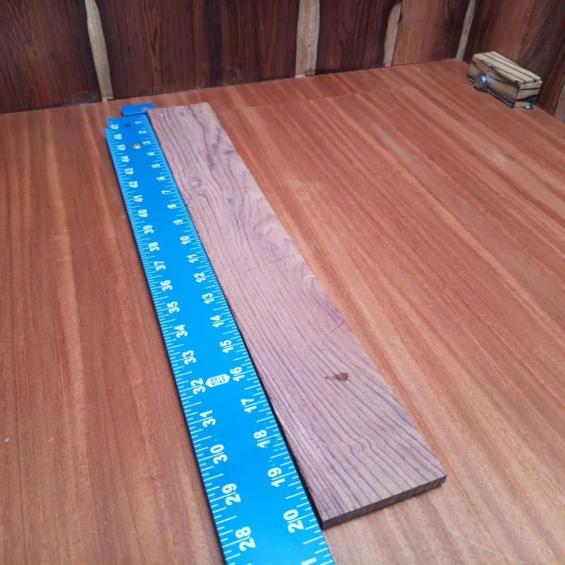 Fingerboard Blanks 43 Unlock your creativity with this premium Honduran Rosewood fingerboard blank, perfect for luthiers. Known for its rich tonal quality and stunning grain, it will elevate your acoustic projects. The dense structure ensures durability, while the rift sawn cut provides a beautiful, uniform appearance. Ideal for crafting unique instruments that resonate beautifully, this blank is a must-have for any serious woodworker. It is a Honduran Rosewood Acoustic Rift Sawn fingerboard blank with dimensions of 20.3 x 2.9 x 0.3 inches.