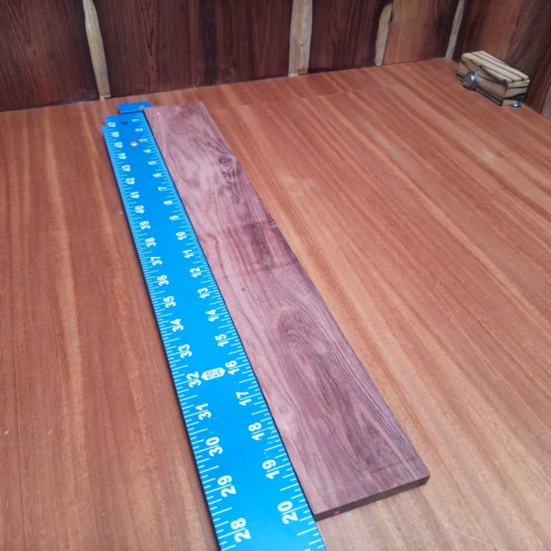 Unlock your creativity with our Honduran Rosewood blank, ideal for crafting stunning fingerboards. This beautifully rift-sawn wood is not only visually striking but also offers great playability and tonal richness. Perfect for luthiers looking to enhance their instruments with unique design elements, this rosewood provides exceptional stability and a warm sound. Elevate your builds and impress musicians with the quality of your craftsmanship! It is a Honduran Rosewood Acoustic Rift Sawn fingerboard blank with dimensions of 20.2 x 2.9 x 0.4 inches.