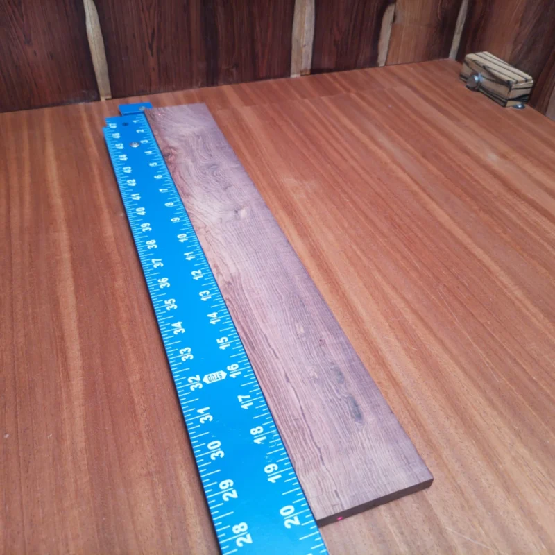 Upgrade your luthier toolkit with this premium Honduran rosewood blank. Ideal for crafting stunning acoustic instruments, this rift sawn wood offers incredible tonal richness and durability. Dive into the world of woodworking with a material that enhances both aesthetics and sound quality for your next project. Whether you're a seasoned pro or a passionate hobbyist, this fingerboards blank is your perfect partner in creating musical magic. It is a Honduran Rosewood Acoustic Rift Sawn fingerboard blank with dimensions of 20.2 x 2.9 x 0.4 inches.