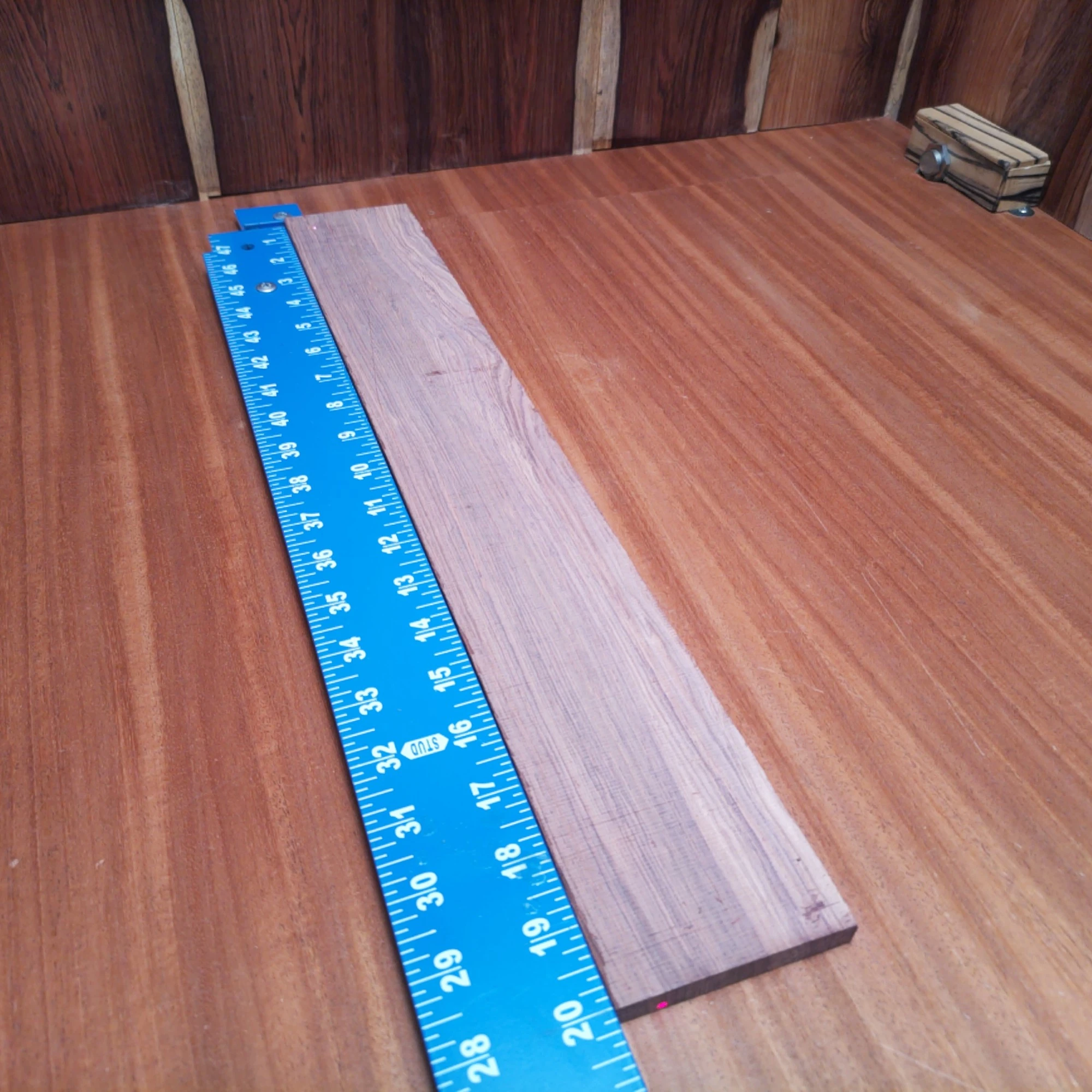 Honduran Rosewood Acoustic Rift Sawn Fingerboard Blank 0.4" X 2.9" X 20.1" - HRAFBR000606 1 Crafted from premium Honduran Rosewood, this acoustic fingerboard blank offers rich tonal warmth and incredible resonance. Designed specifically for luthiers, this blank's rift-sawn nature ensures straight grain patterns that not only look stunning but enhance your instrument’s sound quality. Elevate your guitar projects with this durable and visually appealing piece, perfect for creating your next masterpiece. It is a Honduran Rosewood Acoustic Rift Sawn fingerboard blank with dimensions of 20.1 x 2.9 x 0.4 inches.