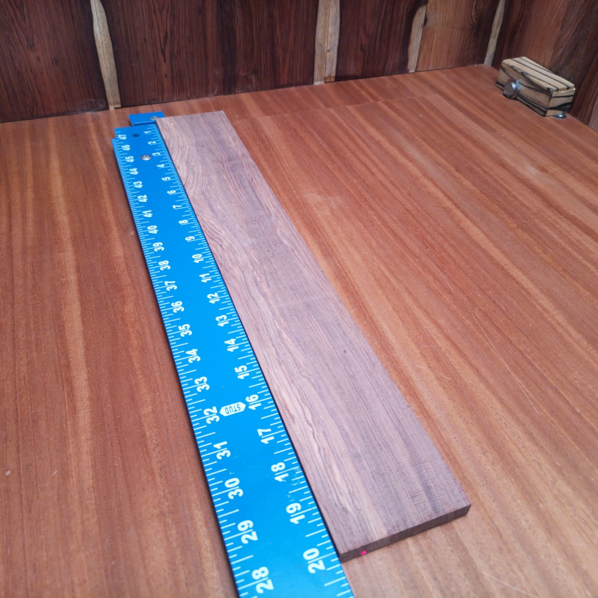 Honduran Rosewood Acoustic Rift Sawn Fingerboard Blank 0.4" X 2.9" X 20.1" - HRAFBR000606 2 Crafted from premium Honduran Rosewood, this acoustic fingerboard blank offers rich tonal warmth and incredible resonance. Designed specifically for luthiers, this blank's rift-sawn nature ensures straight grain patterns that not only look stunning but enhance your instrument’s sound quality. Elevate your guitar projects with this durable and visually appealing piece, perfect for creating your next masterpiece. It is a Honduran Rosewood Acoustic Rift Sawn fingerboard blank with dimensions of 20.1 x 2.9 x 0.4 inches.