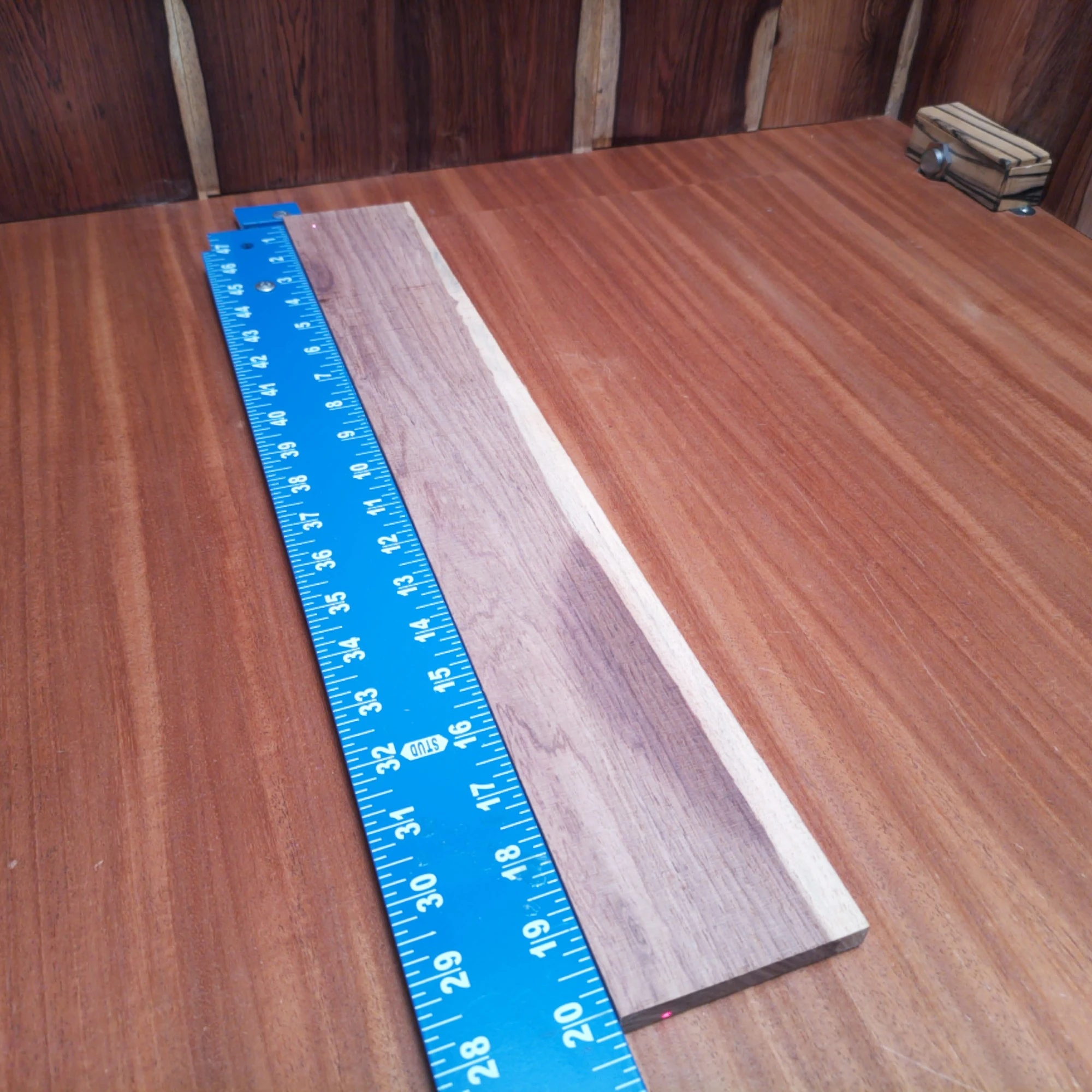 Honduran Rosewood Acoustic Rift Sawn Fingerboard Blank 0.4" X 3.0" X 20.1" - HRAFBR000607 2 Unleash your creativity with this Honduran Rosewood acoustic blank, perfect for luthiers. Its rich tonal qualities and beautiful grain patterns provide a unique canvas for your next masterpiece. Whether crafting a new guitar or repairing an old favorite, this high-quality wood ensures superior sound and stunning aesthetics. Get ready to impress musicians and audience alike with the warm undertones and classic appeal of this premium wood! It is a Honduran Rosewood Acoustic Rift Sawn fingerboard blank with dimensions of 20.1 x 3.0 x 0.4 inches.