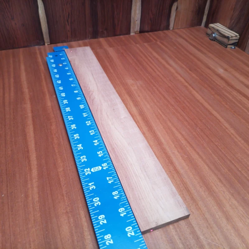 Fingerboard Blanks 80 Elevate your crafting game with this Honduran Rosewood fingerboards blank. Perfectly rift-sawn, it provides a stunning look and rich tone for your next acoustic project. Ideal for luthiers seeking superior quality and durability, this versatile wood is ready to bring your musical vision to life. Get ready for better playability and resonance with every note! It is a Honduran Rosewood Acoustic Rift Sawn fingerboard blank with dimensions of 20.2 x 2.5 x 0.4 inches.