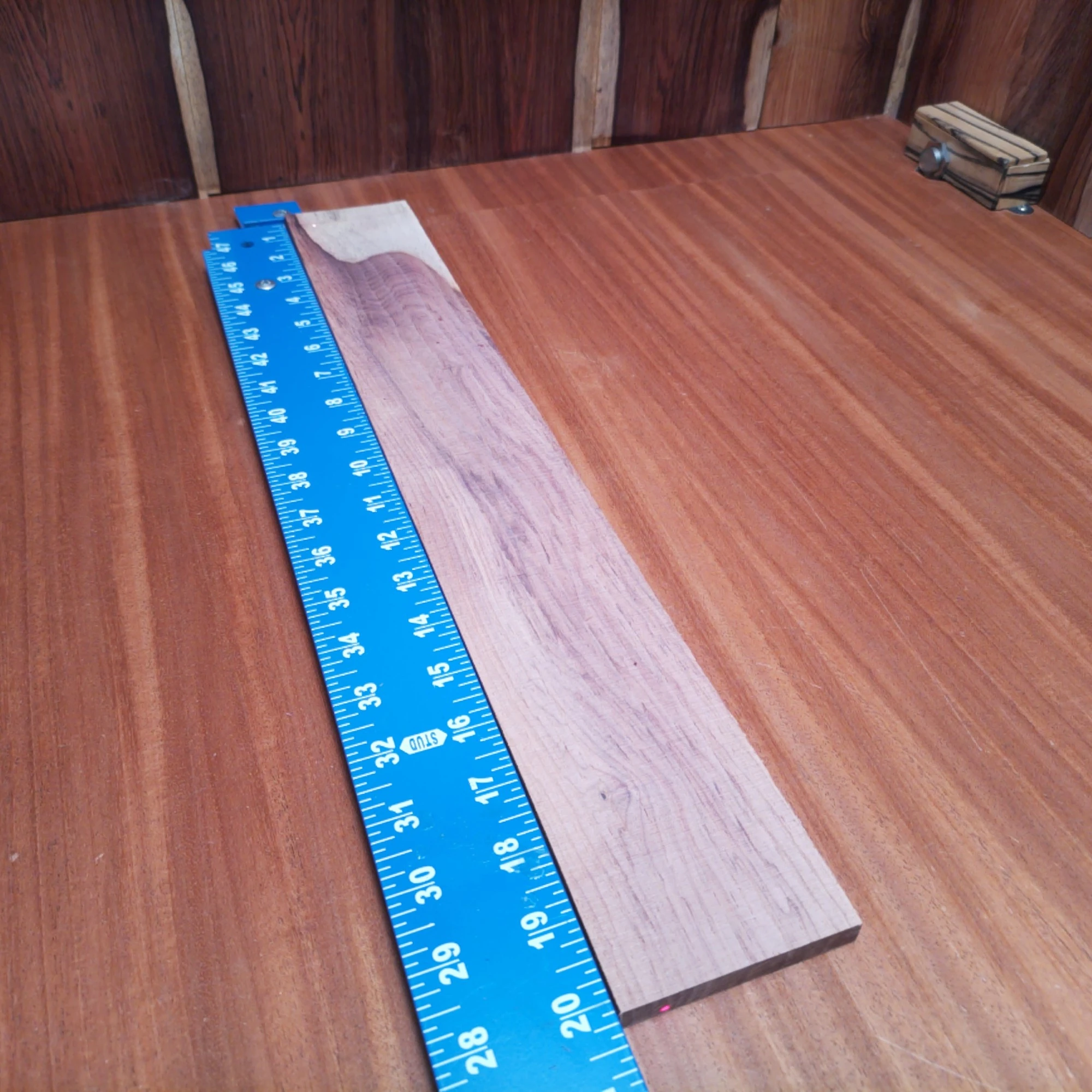 Honduran Rosewood Acoustic Rift Sawn Fingerboard Blank 0.4" X 3.0" X 20.2" - HRAFBR000613 1 Unlock your creativity with this premium Honduran Rosewood blank, perfect for crafting exquisite guitars. With its rich tonal character and beautiful rift-sawn grain, this fingerboard is designed to elevate instrument playing and aesthetic appeal. Whether you're an experienced luthier or a passionate hobbyist, this blank is your next step toward creating a show-stopping acoustic masterpiece. Get ready to impress musicians and audiences alike with your high-quality craftsmanship! It is a Honduran Rosewood Acoustic Rift Sawn fingerboard blank with dimensions of 20.2 x 3.0 x 0.4 inches.