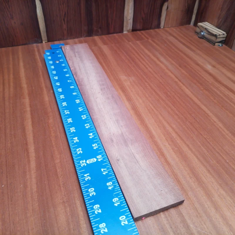 Honduran Rosewood Acoustic Rift Sawn Fingerboard Blank 0.4" X 2.9" X 20.1" - HRAFBR000617 3 Elevate your luthier skills with this stunning Honduran Rosewood blank, perfect for acoustic projects. This rift sawn masterpiece boasts rich tones and unmatched density, ideal for crafting resonant backs and sides. Get ready to create instruments that don’t just sound great but also look amazing! Whether you're a pro or a hobbyist, this versatile fingerboard blank opens up endless possibilities for your next acoustic guitar. It is a Honduran Rosewood Acoustic Rift Sawn fingerboard blank with dimensions of 20.1 x 2.9 x 0.4 inches.