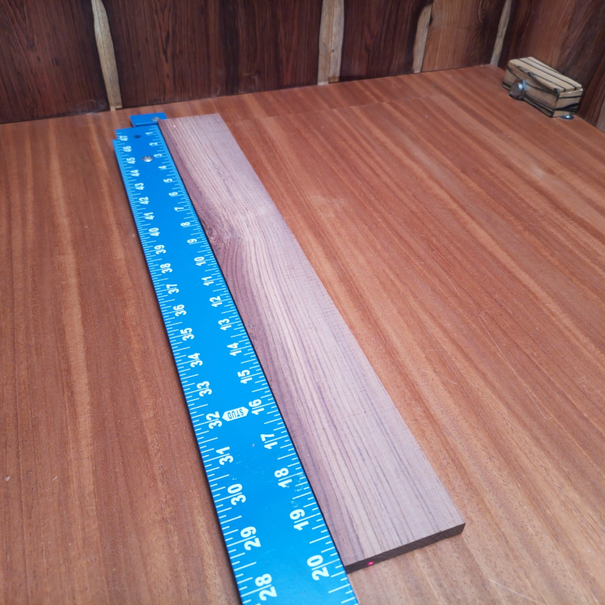 Honduran Rosewood Acoustic Rift Sawn Fingerboard Blank 0.4" X 2.7" X 20.1" - HRAFBR000620 1 Dive into the world of craftsmanship with this Honduran Rosewood fingerboard blank. Ideal for luthiers, it provides a beautiful grain pattern and rich tonal qualities. This versatile blank measures 0.4" x 2.7" x 20.1", perfect for creating stunning acoustic instruments. Elevate your builds and experience the classic warmth and resonance of this premier hardwood. It is a Honduran Rosewood Acoustic Rift Sawn fingerboard blank with dimensions of 20.1 x 2.7 x 0.4 inches.