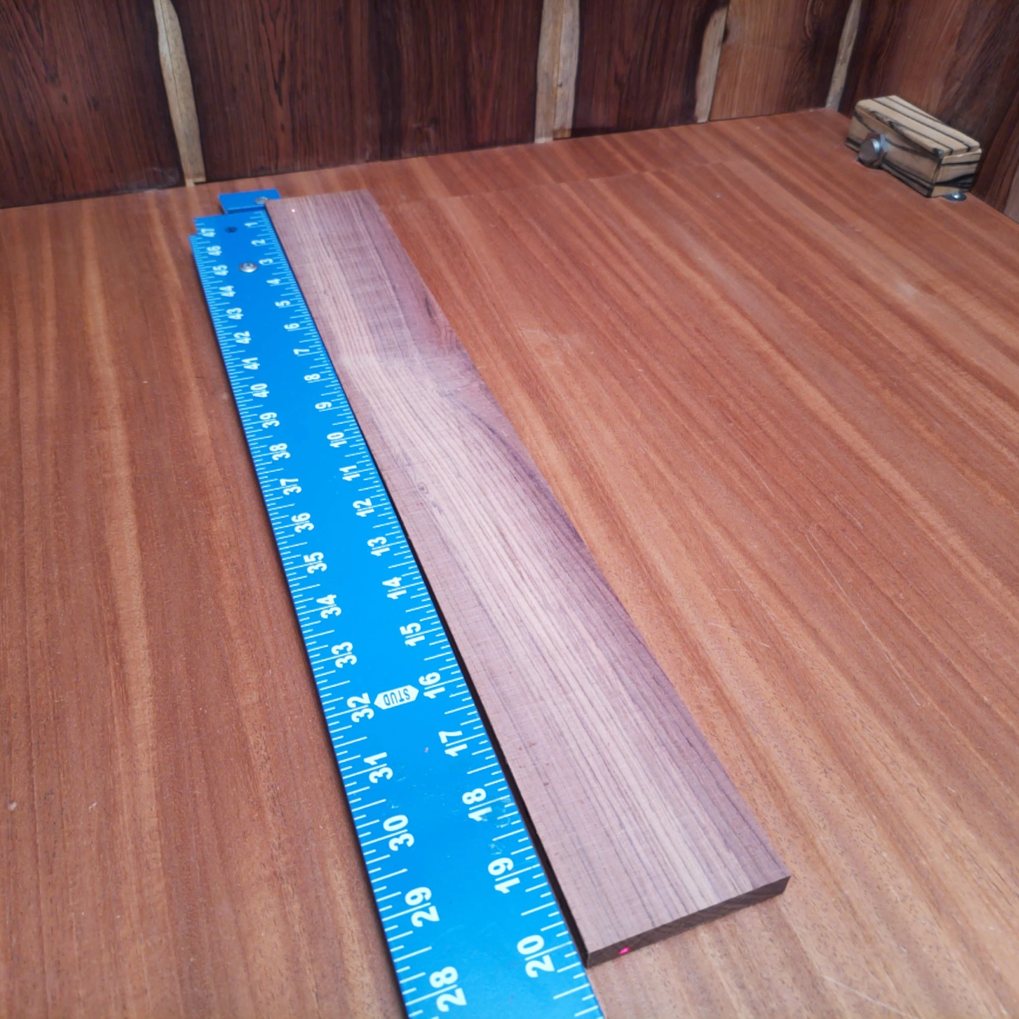 Honduran Rosewood Acoustic Rift Sawn Fingerboard Blank 0.4" X 2.7" X 20.1" - HRAFBR000620 2 Dive into the world of craftsmanship with this Honduran Rosewood fingerboard blank. Ideal for luthiers, it provides a beautiful grain pattern and rich tonal qualities. This versatile blank measures 0.4" x 2.7" x 20.1", perfect for creating stunning acoustic instruments. Elevate your builds and experience the classic warmth and resonance of this premier hardwood. It is a Honduran Rosewood Acoustic Rift Sawn fingerboard blank with dimensions of 20.1 x 2.7 x 0.4 inches.