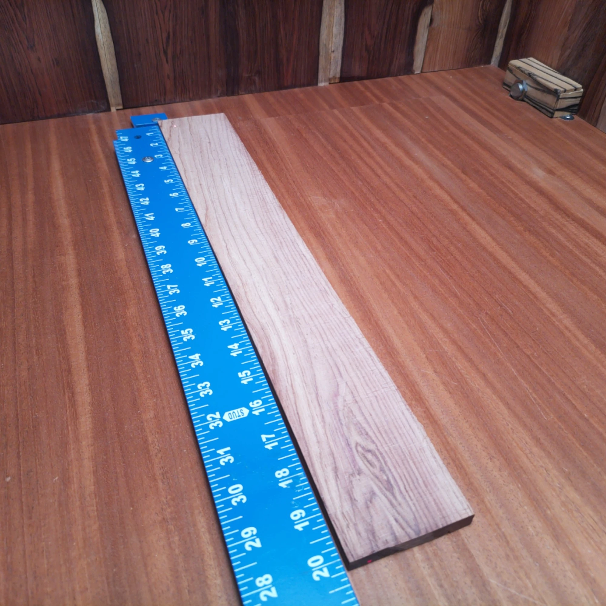 Honduran Rosewood Acoustic Rift Sawn Fingerboard Blank 0.4" X 2.9" X 20.1" - HRAFBR000625 1 Crafted from premium Honduran rosewood, this fingerboards blank is your key to unlocking beautiful acoustic tones. Measuring 0.4" X 2.9" X 20.1", it's perfect for luthiers aiming for effortless playability and rich sound. The tight grain and gorgeous color ensure your instrument will stand out while providing warmth and resonance. Get ready to create unforgettable music with this superbly crafted fingerboard blank. It is a Honduran Rosewood Acoustic Rift Sawn fingerboard blank with dimensions of 20.1 x 2.9 x 0.4 inches.