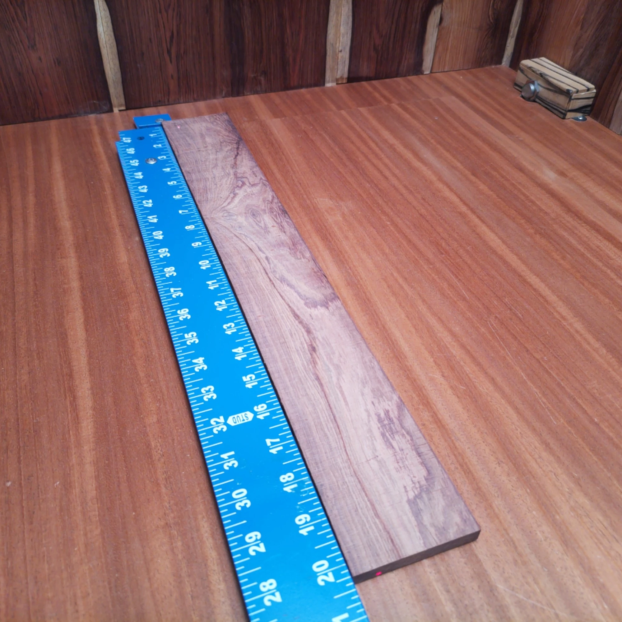 Honduran Rosewood Acoustic Rift Sawn Fingerboard Blank 0.4" X 2.8" X 20.3" - HRAFBR000626 2 Experience the rich tonal quality of our Honduran Rosewood blank, perfect for crafting premium acoustic instruments. This rift sawn piece balances beauty and performance, making it a favorite among luthiers. Its dense grain not only enhances resonance but also ensures durability, giving your creations a sound that resonates with depth and character. Elevate your next project with this exquisite material! It is a Honduran Rosewood Acoustic Rift Sawn fingerboard blank with dimensions of 20.3 x 2.8 x 0.4 inches.