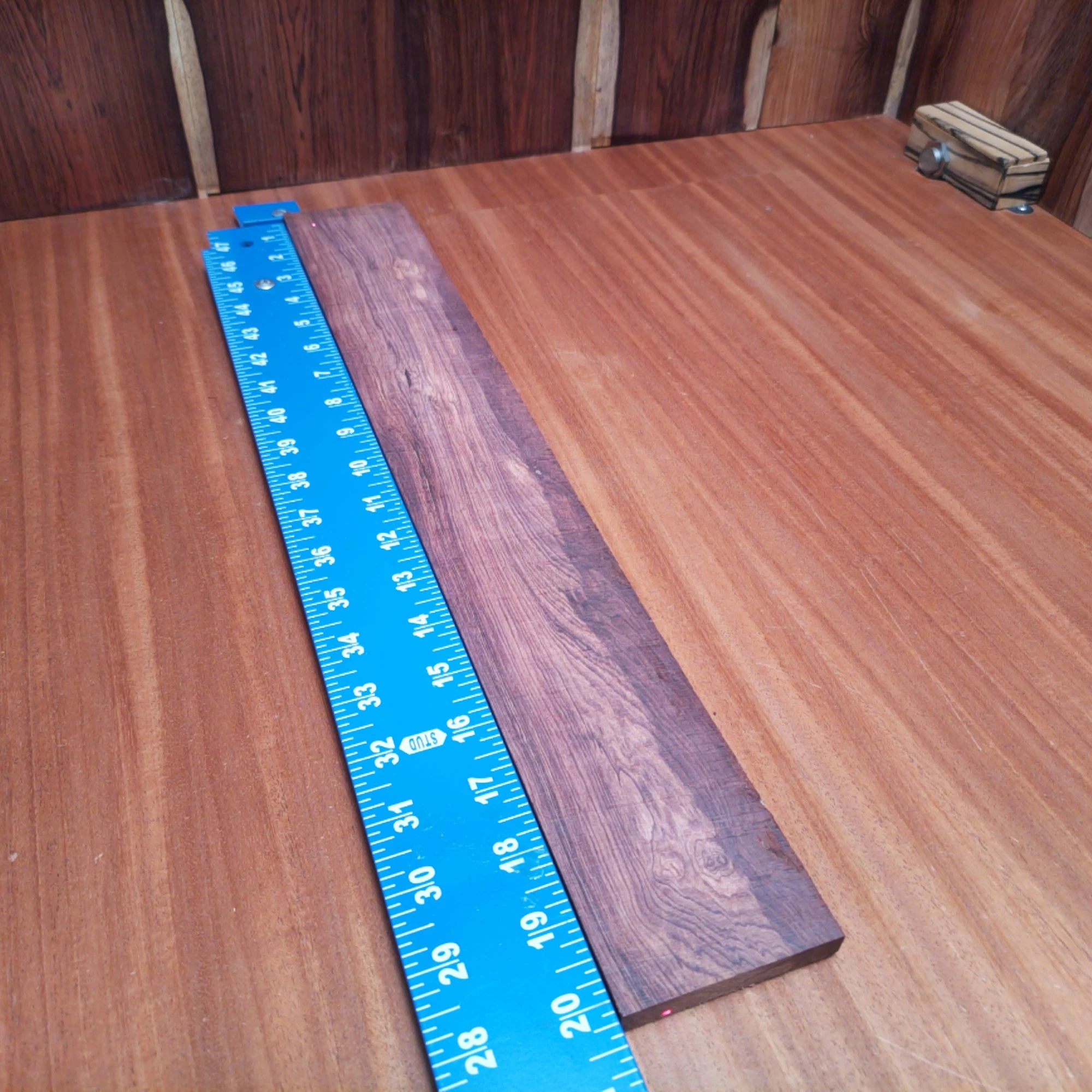 Honduran Rosewood Acoustic Rift Sawn Fingerboard Blank 0.4" X 2.9" X 20.2" - HRAFBR000627 1 Unlock the secrets of sound with this premium Honduran Rosewood blank. Perfect for luthiers seeking to create rich-toned acoustic instruments, this wood boasts a stunning rift sawn grain, ensuring durability and tonal clarity. Ideal for strumming or fingerpicking, it brings style and substance to your musical creations. Crafted to inspire, your guitar or ukulele will be music to everyone’s ears! It is a Honduran Rosewood Acoustic Rift Sawn fingerboard blank with dimensions of 20.2 x 2.9 x 0.4 inches.