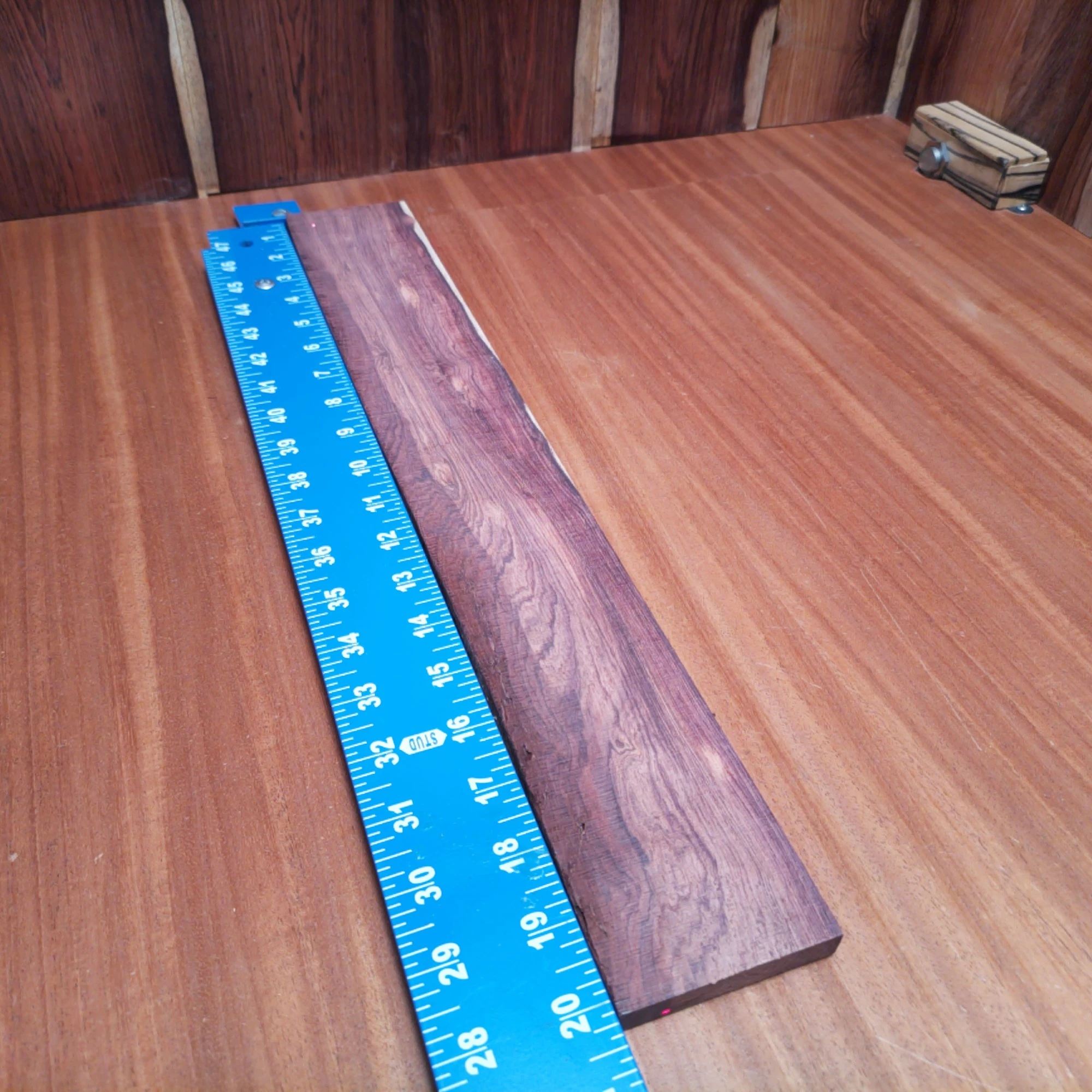 Honduran Rosewood Acoustic Rift Sawn Fingerboard Blank 0.4" X 2.9" X 20.2" - HRAFBR000627 2 Unlock the secrets of sound with this premium Honduran Rosewood blank. Perfect for luthiers seeking to create rich-toned acoustic instruments, this wood boasts a stunning rift sawn grain, ensuring durability and tonal clarity. Ideal for strumming or fingerpicking, it brings style and substance to your musical creations. Crafted to inspire, your guitar or ukulele will be music to everyone’s ears! It is a Honduran Rosewood Acoustic Rift Sawn fingerboard blank with dimensions of 20.2 x 2.9 x 0.4 inches.