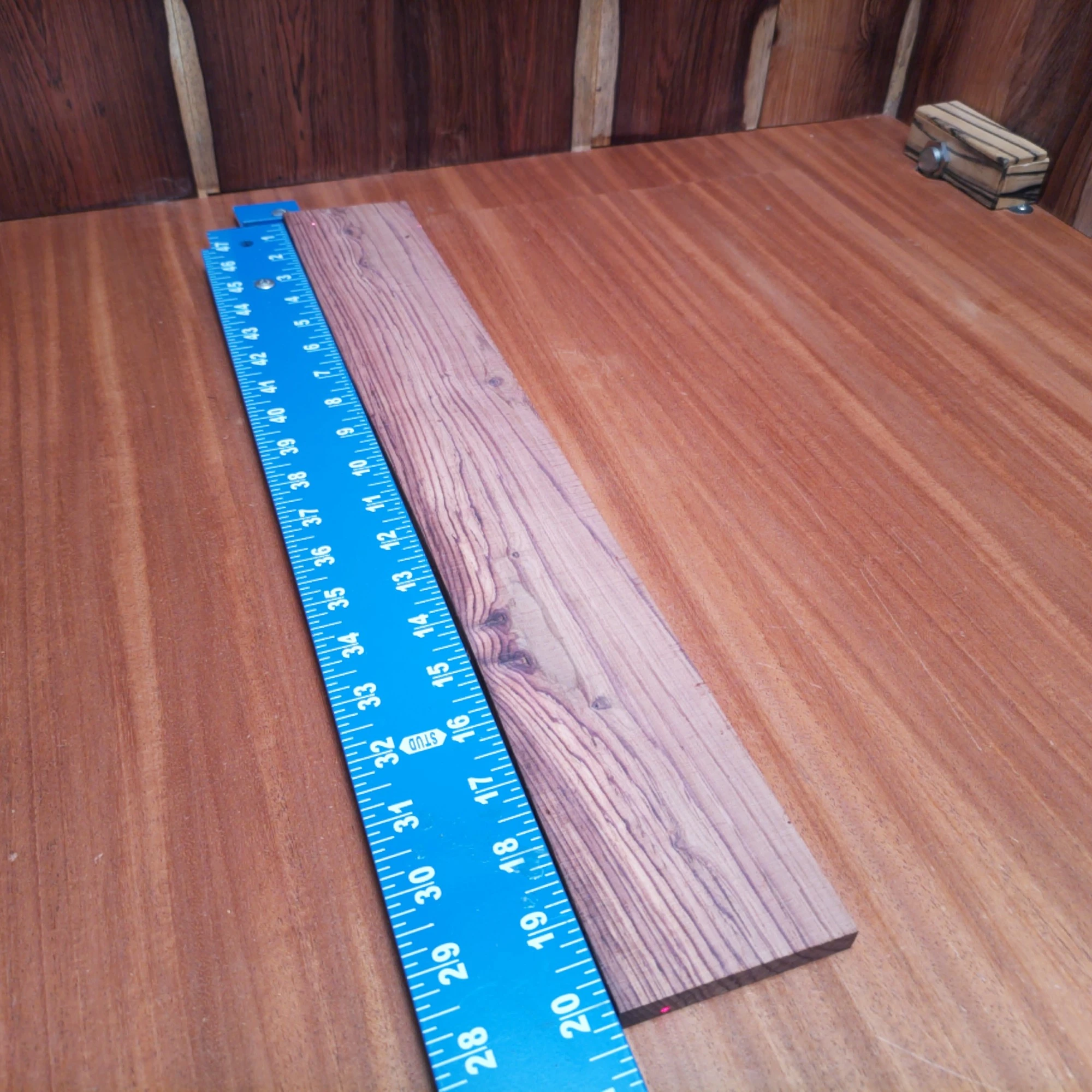 Honduran Rosewood Acoustic Rift Sawn Fingerboard Blank 0.4" X 3.0" X 20.2" - HRAFBR000628 2 Elevate your guitar crafting game with this premium Honduran Rosewood blank. Known for its stunning grain and resonant tone, it's the perfect choice for luthiers seeking to create a masterpiece. This acoustic rift sawn option guarantees uniformity, making it easier to achieve that perfect sound. Ideal for crafting bright, clear tones while adding natural beauty to your instruments. Get ready to impress with your next build! It is a Honduran Rosewood Acoustic Rift Sawn fingerboard blank with dimensions of 20.2 x 3.0 x 0.4 inches.