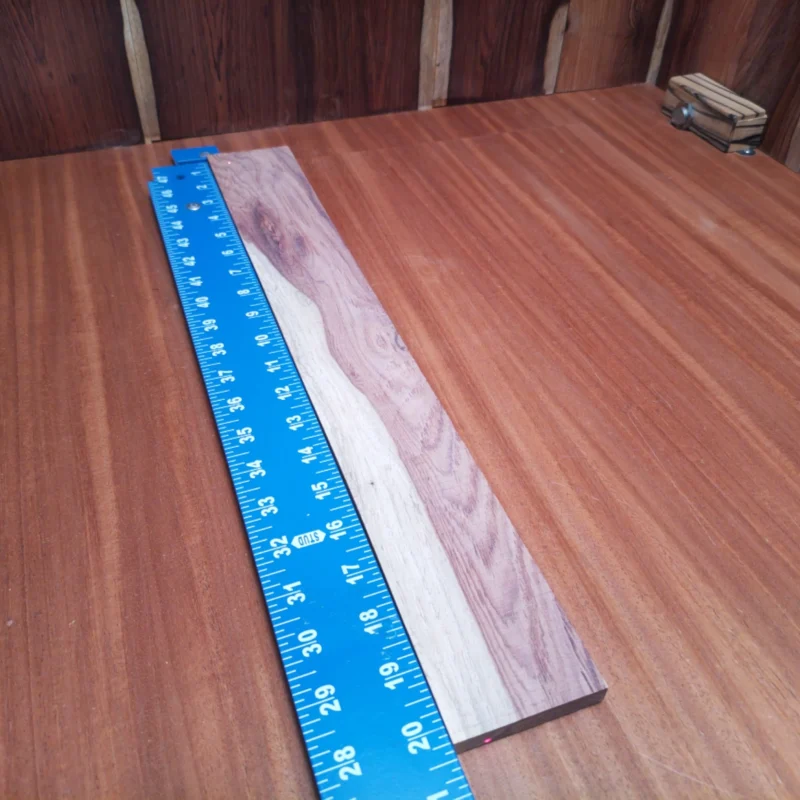 Fingerboard Blanks 131 Unlock your creativity with this quality rift sawn Honduran rosewood fingerboard blank. Perfect for luthiers seeking a durable and beautiful foundation for acoustic instruments. With its rich sound and exquisite grain patterns, this fingerboard will elevate your craftsmanship and enhance playability. Perfect for both seasoned pros and beginners looking to build their next masterpiece! It is a Honduran Rosewood Acoustic Rift Sawn fingerboard blank with dimensions of 20.3 x 2.7 x 0.4 inches.