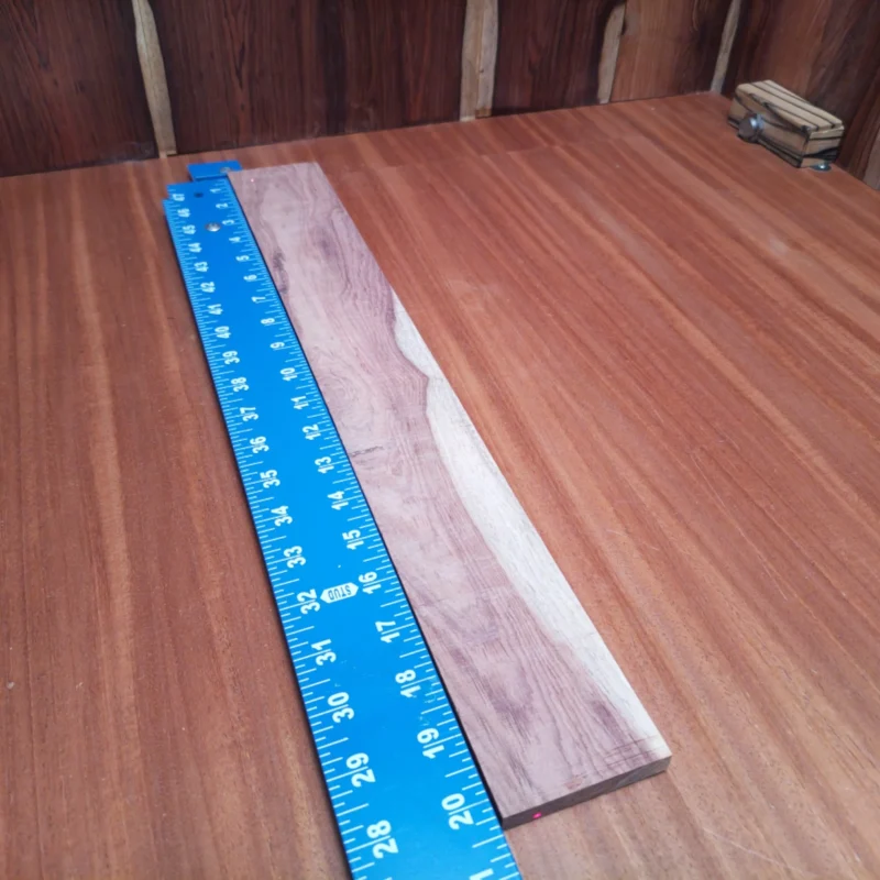 Unlock your creativity with this quality rift sawn Honduran rosewood fingerboard blank. Perfect for luthiers seeking a durable and beautiful foundation for acoustic instruments. With its rich sound and exquisite grain patterns, this fingerboard will elevate your craftsmanship and enhance playability. Perfect for both seasoned pros and beginners looking to build their next masterpiece! It is a Honduran Rosewood Acoustic Rift Sawn fingerboard blank with dimensions of 20.3 x 2.7 x 0.4 inches.