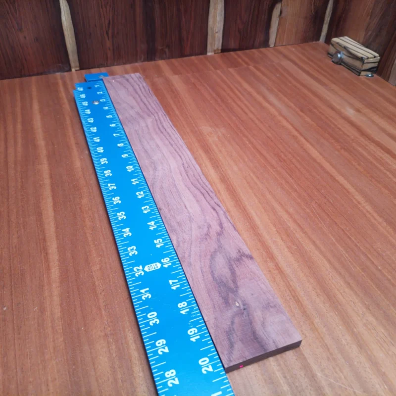 Fingerboard Blanks 83 Elevate your luthier game with this Honduran Rosewood blank. Perfectly rift sawn, its rich grain and warm tones provide a stunning backdrop for crafting amazing acoustic instruments. Whether for a guitar or ukulele, this blank guarantees superb resonance and a smooth finish. Ideal for both professionals and hobbyists, it offers the premium quality that serious creators seek. It is a Honduran Rosewood Acoustic Rift Sawn fingerboard blank with dimensions of 20.3 x 2.5 x 0.4 inches.