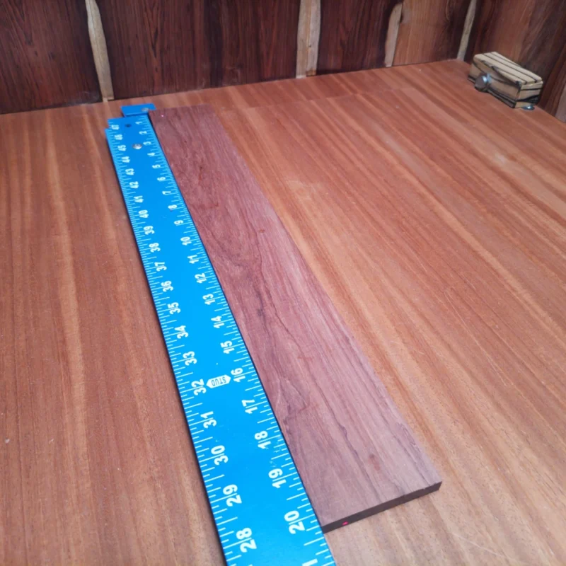 Crafted from premium Honduran Rosewood, this fingerboard blank is ideal for luthiers seeking rich tonal quality and striking visuals. At 0.4 inches thick, it offers durability while ensuring easy shaping to your preferred specifications. Experience the perfect blend of warmth and clarity in every note with this versatile fingerboard, ideal for both acoustic and electric instruments. Elevate your craft with a material that musicians will love! It is a Honduran Rosewood Acoustic Rift Sawn fingerboard blank with dimensions of 20.3 x 2.9 x 0.4 inches.