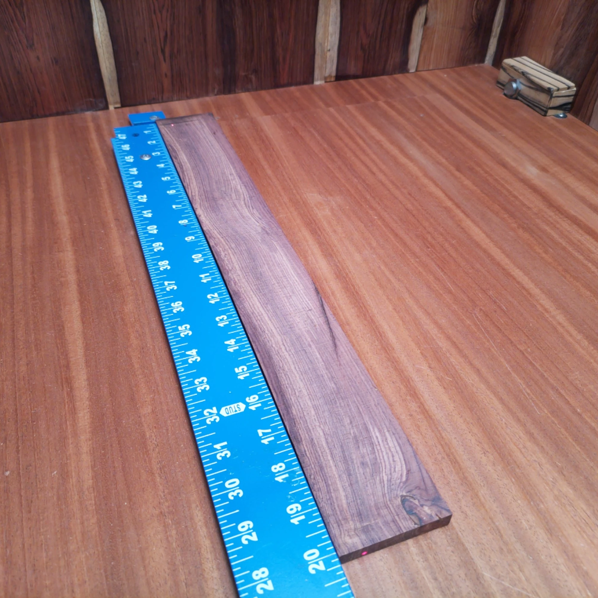 Honduran Rosewood Acoustic Rift Sawn Fingerboard Blank 0.4" X 2.4" X 20.1" - HRAFBR000641 1 This Honduran rosewood blank is a must-have for luthiers. Its dense 0.4" thickness provides outstanding tonal response, while the striking grain pattern brings a visual appeal to any acoustic project. Perfect for crafting guitar back and sides, this versatile blank combines durability and resonance, making your instruments sing with clarity. Elevate your next build with a material that enhances every note and looks good doing it! It is a Honduran Rosewood Acoustic Rift Sawn fingerboard blank with dimensions of 20.1 x 2.4 x 0.4 inches.