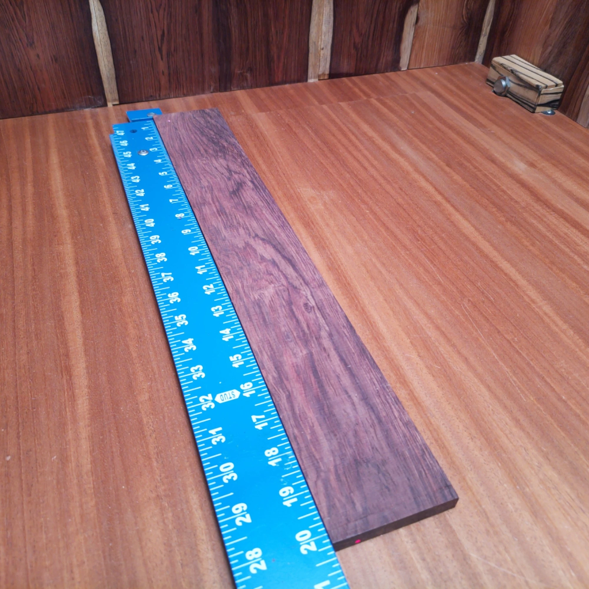 Honduran Rosewood Acoustic Rift Sawn Fingerboard Blank 0.4" X 2.9" X 20.3" - HRAFBR000645 2 This Honduran rosewood fingerboard blank is perfect for crafting high-quality acoustic instruments. With its beautiful grain and warm tonal qualities, this rift-sawn piece offers luthiers a reliable source for stunning fingerboards. Its dimensions make it versatile enough for various projects, enhancing playability and aesthetic value. Elevate your creations with this premium wood, designed for both performance and durability. It is a Honduran Rosewood Acoustic Rift Sawn fingerboard blank with dimensions of 20.3 x 2.9 x 0.4 inches.
