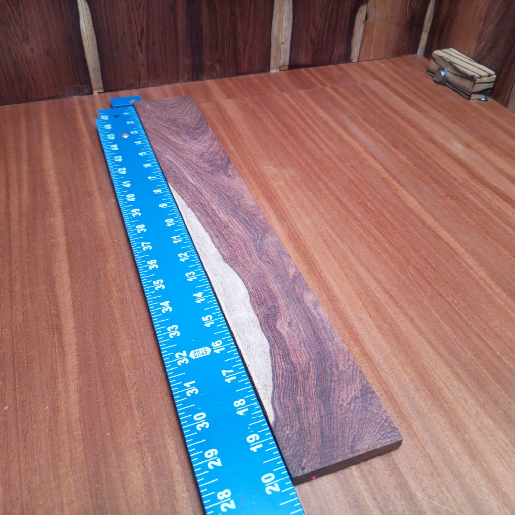 Honduran Rosewood Acoustic Rift Sawn Fingerboard Blank 0.4" X 2.9" X 20.1" - HRAFBR000647 1 Crafted from premium Honduran rosewood, this acoustic fingerboard blank is perfect for luthiers. Its rift sawn cut enhances stability, allowing for smooth playability without compromising tone quality. Whether you’re crafting a new guitar or repairing an old classic, this fingerboard brings both beauty and functionality to your projects. Say goodbye to fingerboard woes and hello to crisp, vibrant sound with every strum! It is a Honduran Rosewood Acoustic Rift Sawn fingerboard blank with dimensions of 20.1 x 2.9 x 0.4 inches.