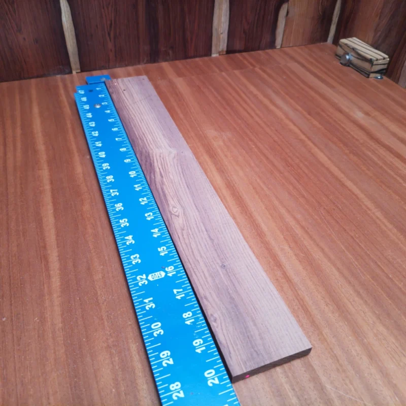 Honduran Rosewood Acoustic Rift Sawn Fingerboard Blank 0.4" X 2.7" X 20.2" - HRAFBR000650 3 Elevate your craft with this Honduran Rosewood blank, perfect for luthiers crafting acoustic instruments. Its striking grain and rich tone provide both aesthetic appeal and superior sound quality. Create stunning guitars that resonate beautifully while standing out visually. This versatile blank offers ample size for various projects, ensuring you can bring your musical visions to life with ease and precision. It is a Honduran Rosewood Acoustic Rift Sawn fingerboard blank with dimensions of 20.2 x 2.7 x 0.4 inches.